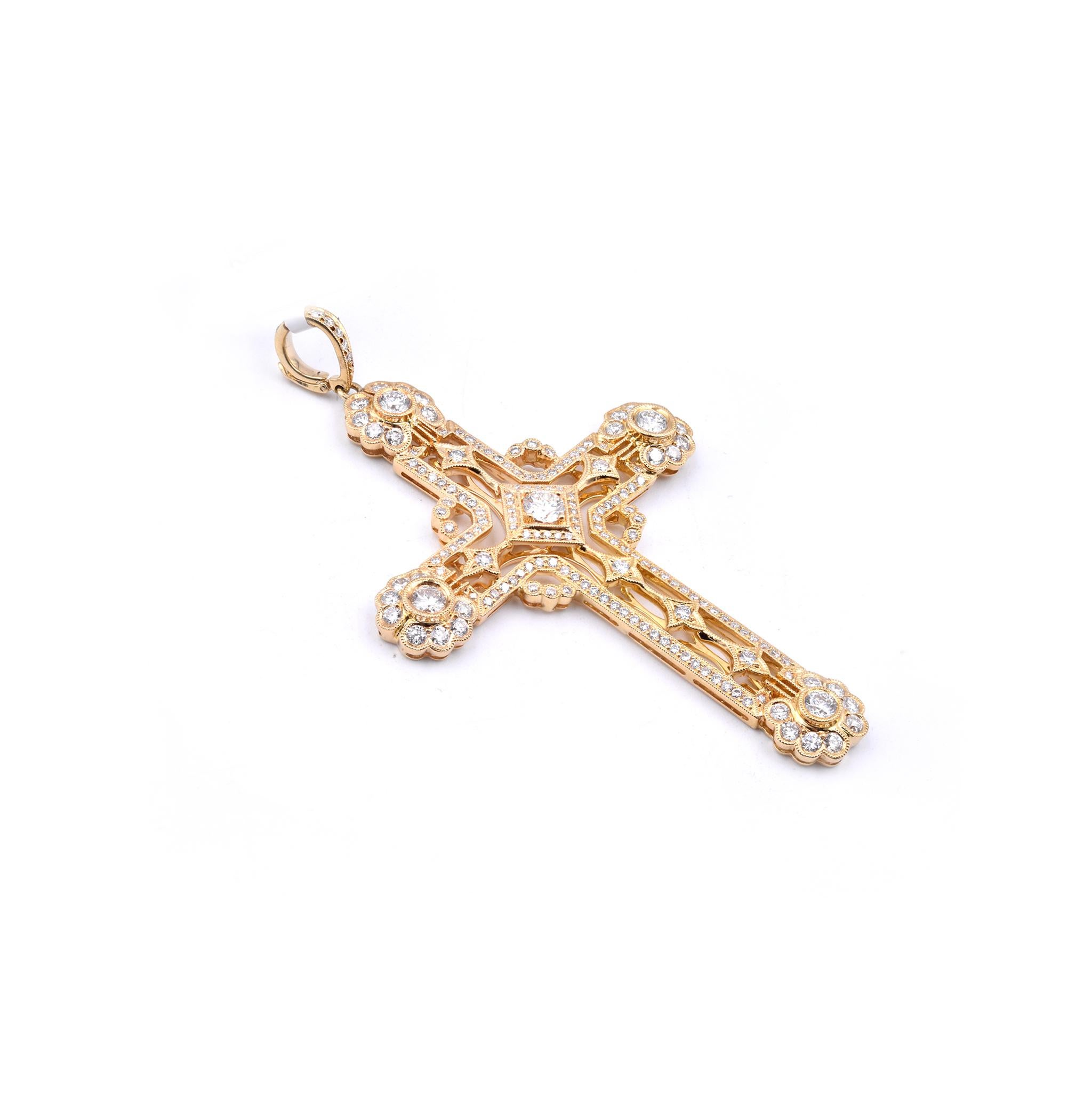 Designer: custom 
Material: 18K yellow gold
Diamonds: 172 round cut = 3.10cttw
Color: H
Clarity: SI1
Dimensions: cross measures 77 X 46mm
Weight: 15.96 grams