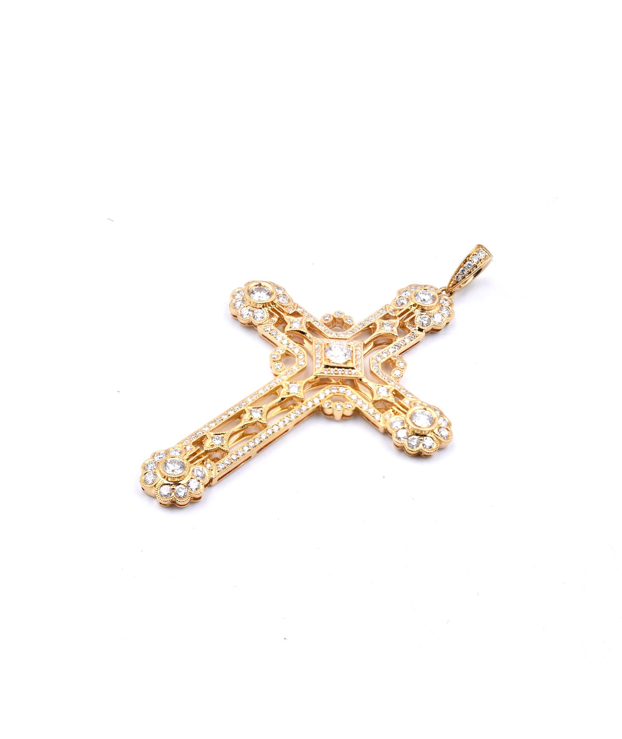 gold cross with diamond in center