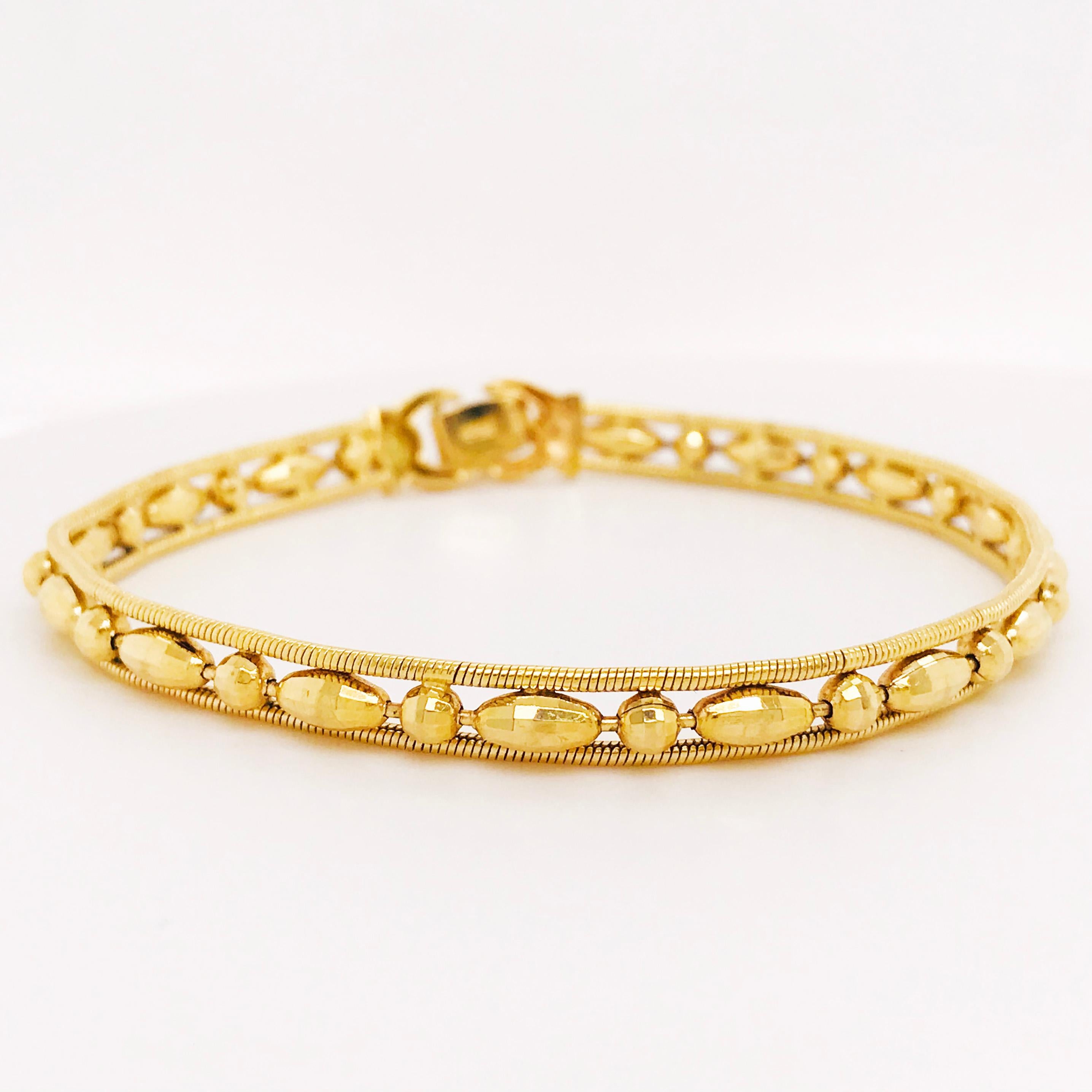 This 18 karat yellow gold diamond cut beaded bracelet is such a fun piece! With unique, hand made beads going all the way around that have each been individually made with a 