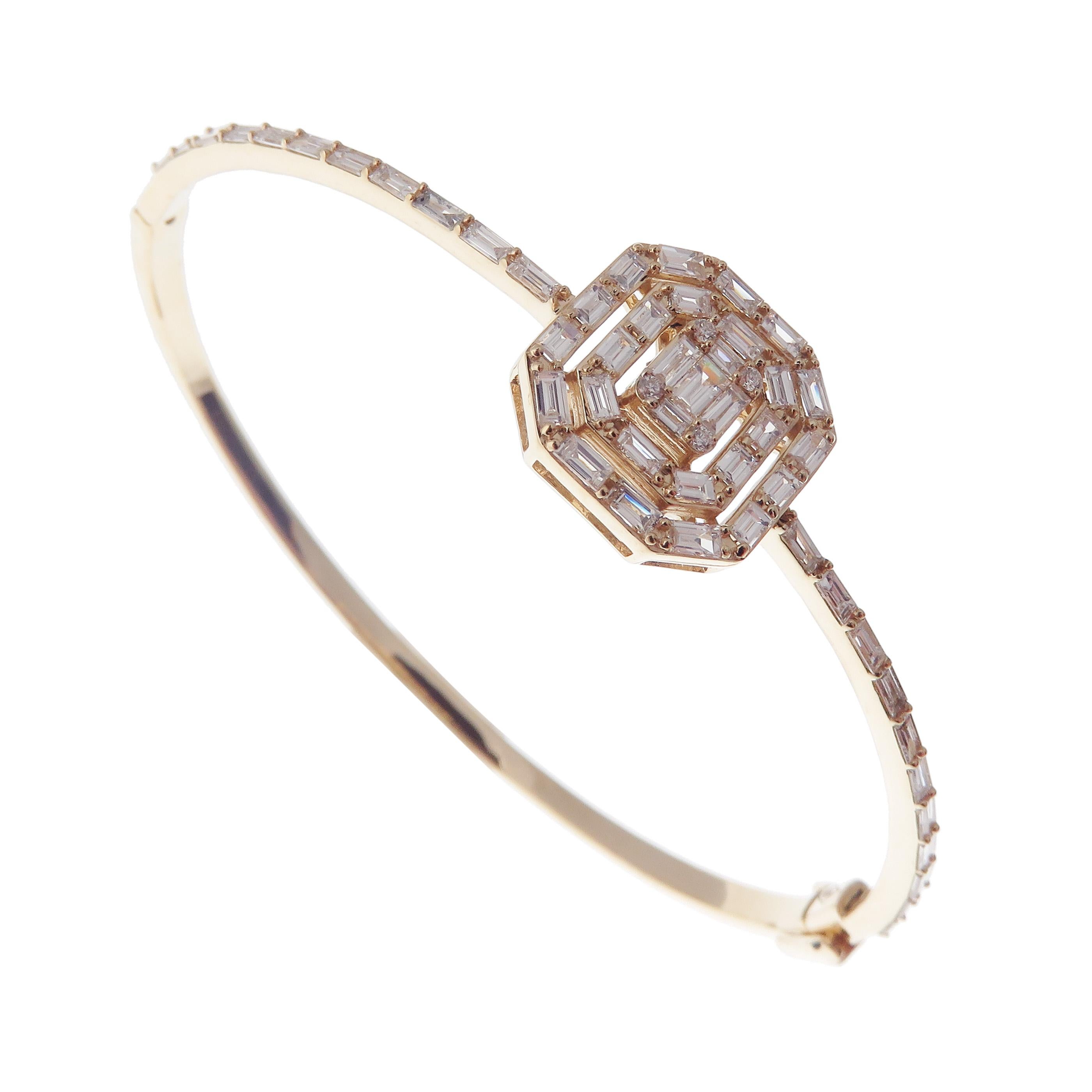 This delicate square bageutte bangle is crafted in 18-karat yellow gold, weighing approximately 1.63 total carats of V-Quality white diamond. Side clasp closure.  

Fits wrists up to 6.75