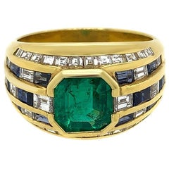 Bague en or jaune 18 carats avec diamant, émeraude et saphir