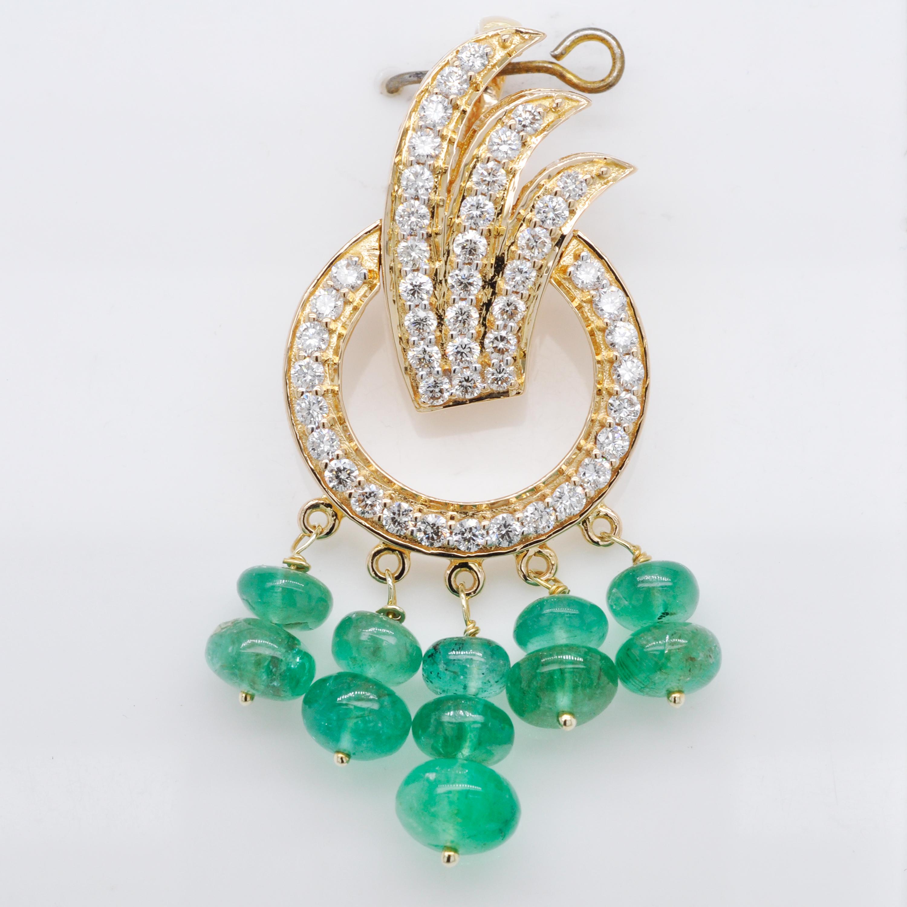 18 karat yellow gold diamond emerald beads pendant necklace dangle earrings set

This 18 karat gold pendant necklace dangle earrings set is a contemporary beauty. The set depicts three diamond feathers encircled by a diamond ring. A touch of green