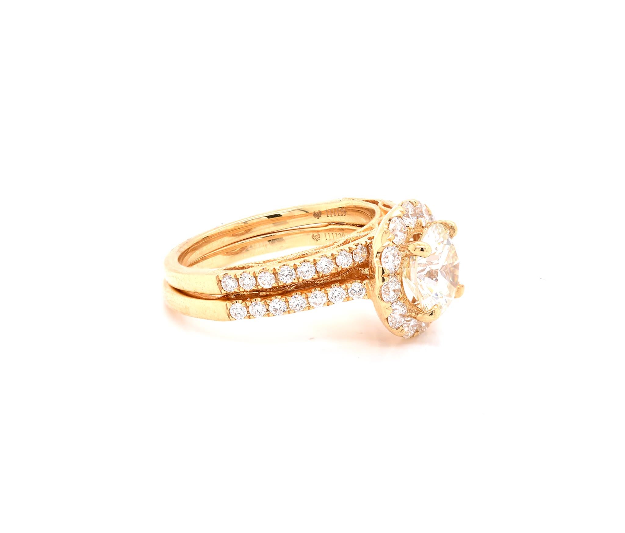 Material: 18K yellow gold
Center Diamond: 1 round brilliant cut = 1.80ct
Color: L
Clarity: VS1
Diamonds: 47 round cut = 1.11cttw
Color: G
Clarity:  VS
Ring Size: 7 (please allow up to 2 additional business days for sizing requests)
Dimensions: ring