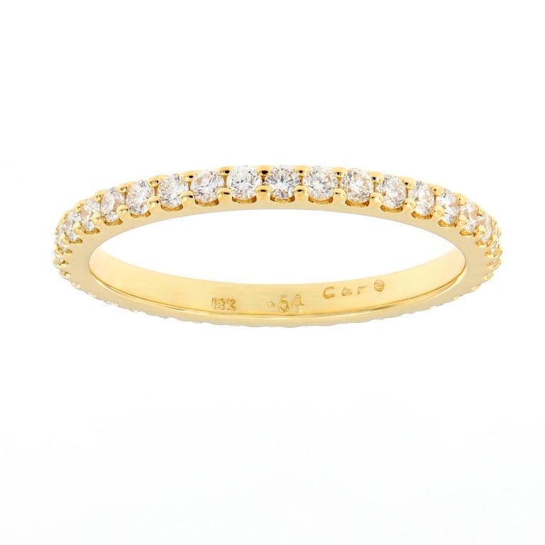 You cannot go wrong with this eternally classic ring crafted in 18k yellow gold with 34 round brilliant cut diamonds = 0.54 Cttw. Ring is great for wearing alone, stacking and would also beautifully complement an engagement ring. Size 6 but can be