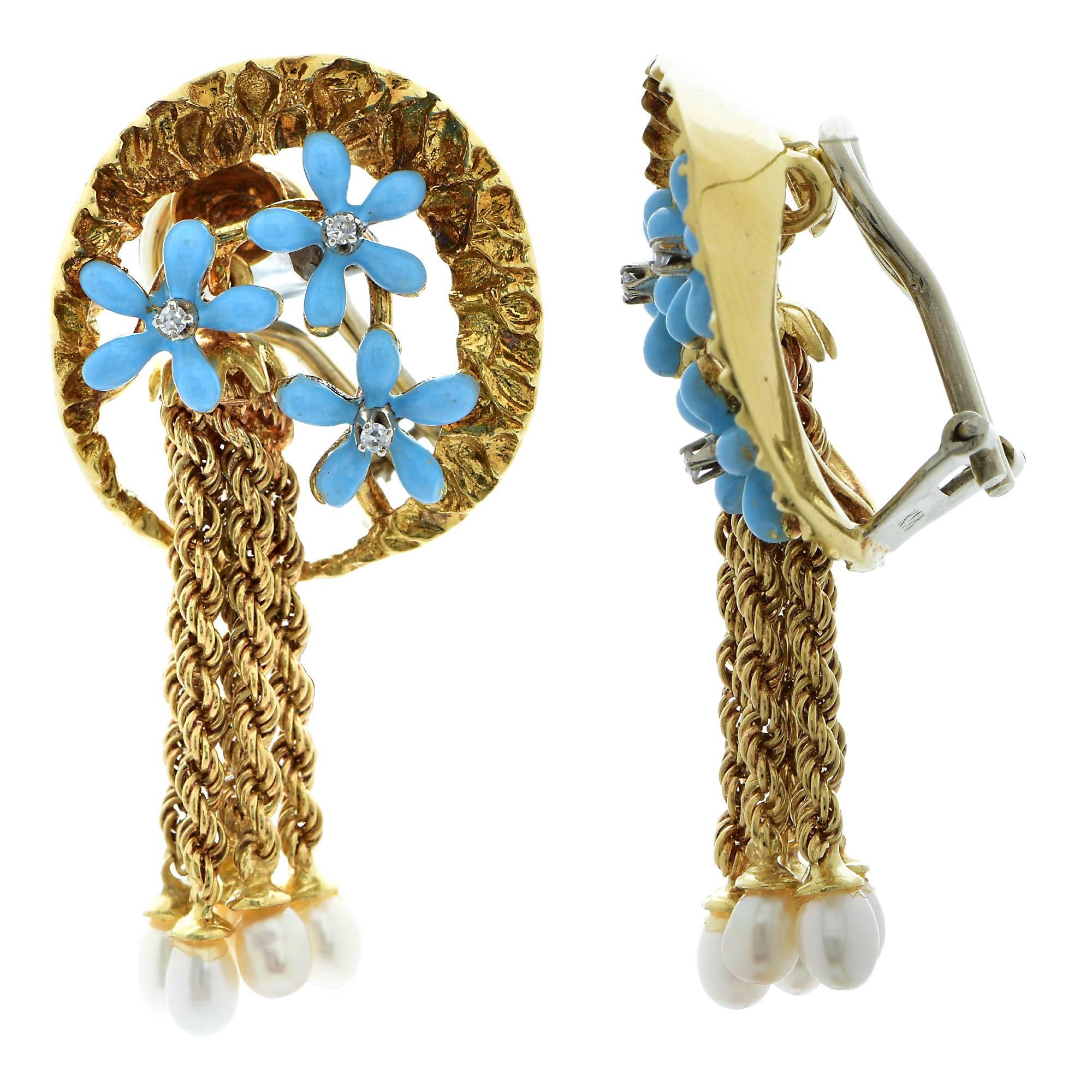 These earrings, crafted in yellow gold feature 6 sky blue enameled flowers adorned with 6 single cut diamonds weighing .06cts total G, VS-SI, Clarity. Dangling from the earrings are 10 3.2mm -3.4mm seed pearls. These fabulous earrings measure 1.7