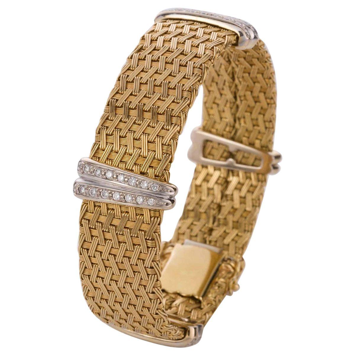 This bracelet is truly sensational -  a finely crafted German woven mesh bracelet in 18ct yellow gold, featuring four white gold double bars showcasing 64 grain set white modern brilliant diamonds weighing approximately  0.80cts. The diamonds are