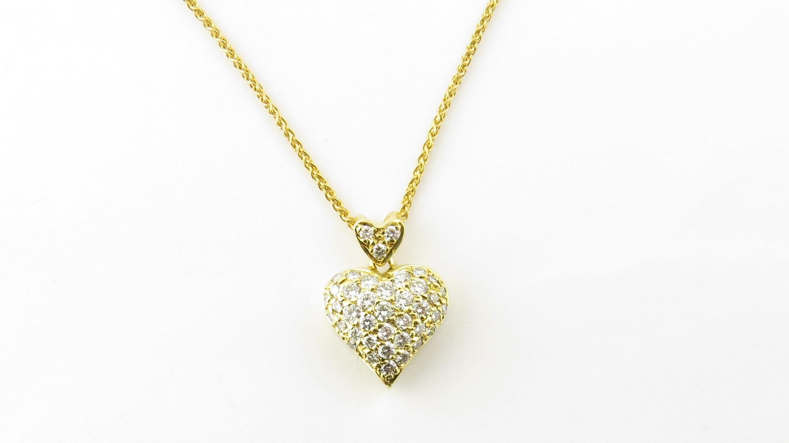 Vintage 18 Karat Yellow Gold Diamond Heart Pendant Necklace

This romantic double heart pendant features 40 round brilliant cut diamonds set in classic 18K yellow gold. Suspended from an elegant 16