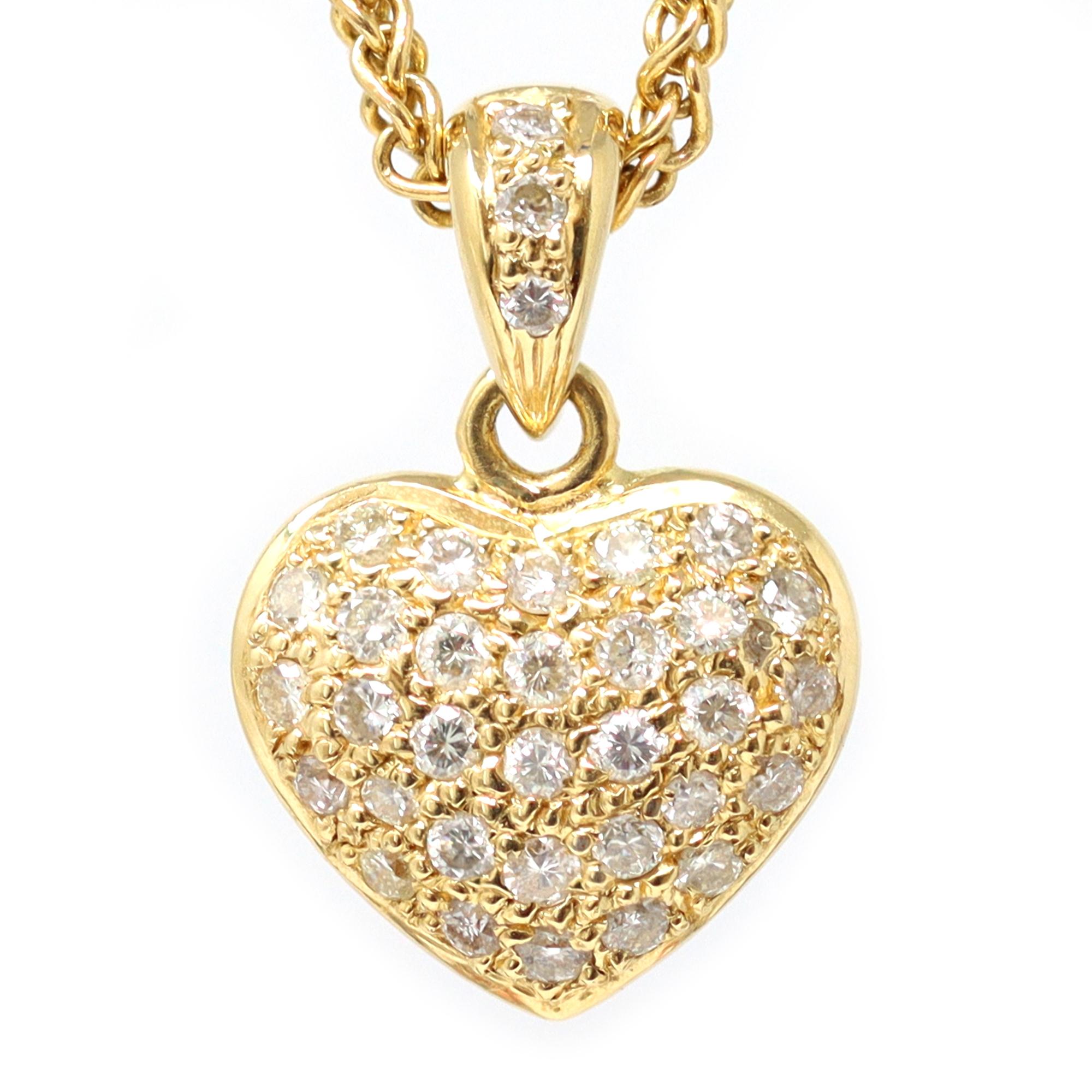 A very well-made classic Heart necklace featuring a pave diamond heart pendant on an intricate multi-link chain.
The diamond weight of 0.46 carats is stamped on the pendant - the diamonds are round in shape with a grade of GH color and VS clarity.