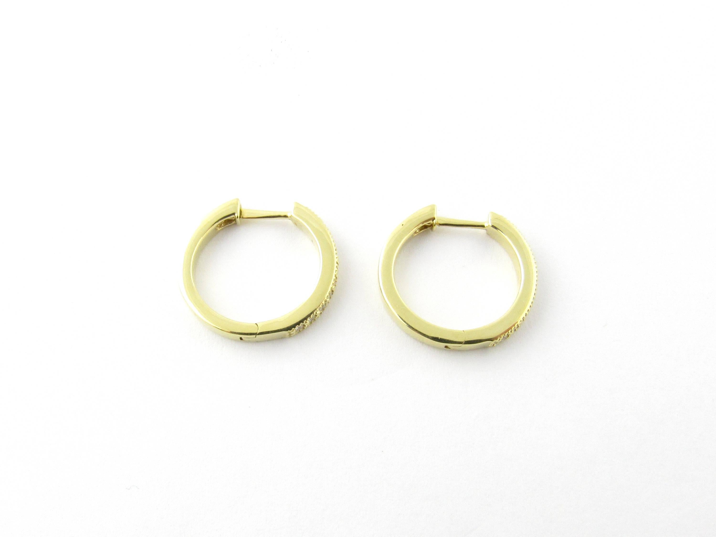 Vintage 18 Karat Yellow Gold Diamond Hoop Earrings

These sparkling hinged hoop earrings each feature ten round brilliant cut diamonds set in beautifully detailed 18K yellow gold.

Approximate total diamond weight: .20 ct.

Diamond color: G

Diamond