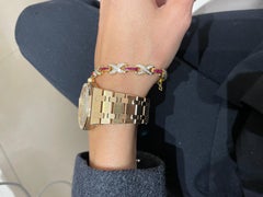 18 Karat Yellow Gold Diamond Infinity Motif and Invisibly Set Ruby Bracelet