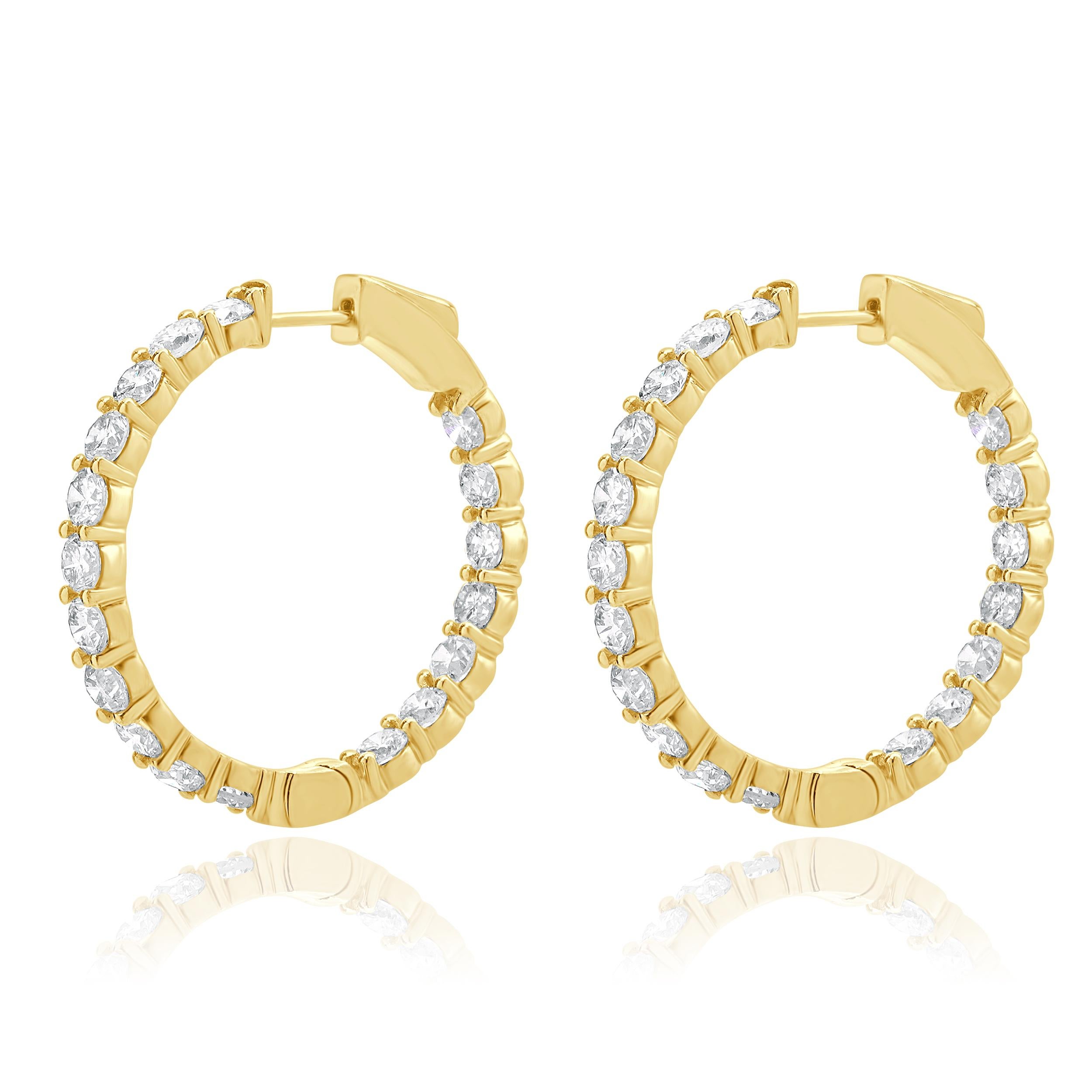 Designer: personalizzato
Materiale: oro giallo 18 carati
Diamante: taglio brillante rotondo = 6,85cttw
Colore: G / H.
Chiarezza: VS2-SI1
Dimensioni: gli orecchini misurano 32 mm di lunghezza
Peso: 14,24 grammi


