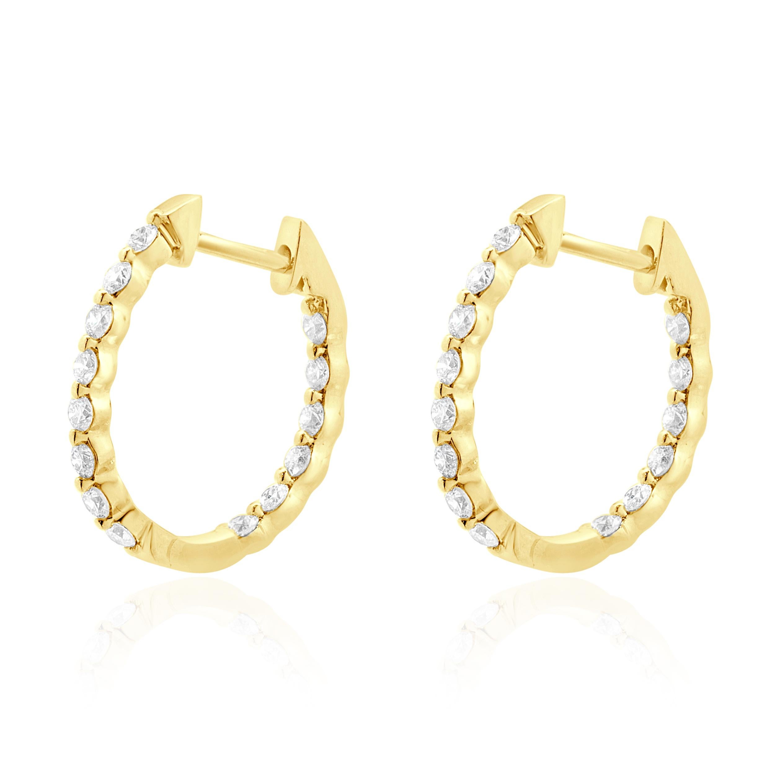 Designer: custom design
Material: 18K yellow gold
Diamonds: 28 round brilliant cut = 0.52cttw
Color: G
Clarity: VS1-2
Dimensions: earrings measure 15mm in length
Weight: 1.90 grams
