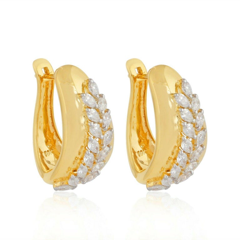 Orecchini a bottone con foglia di diamante naturale. Oro 14k