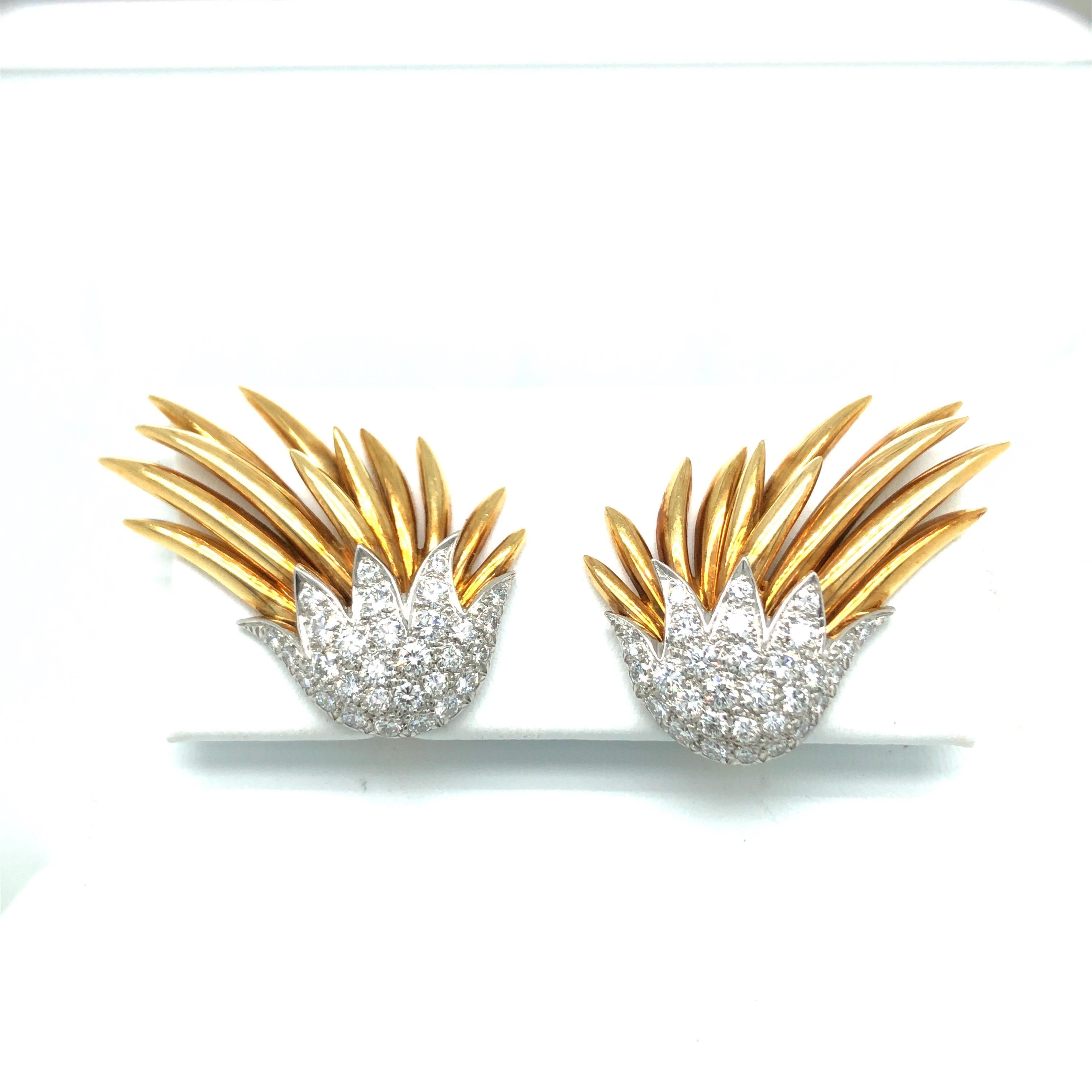 Absolutely fabulous pair of 18 karat yellow gold diamond Paris Flame ear clips by Jean Schlumberger for Tiffany & Co.
Designed to be worn up the lobe, they consist of 18 karat polished yellow gold flames coming out of platinum buds set with