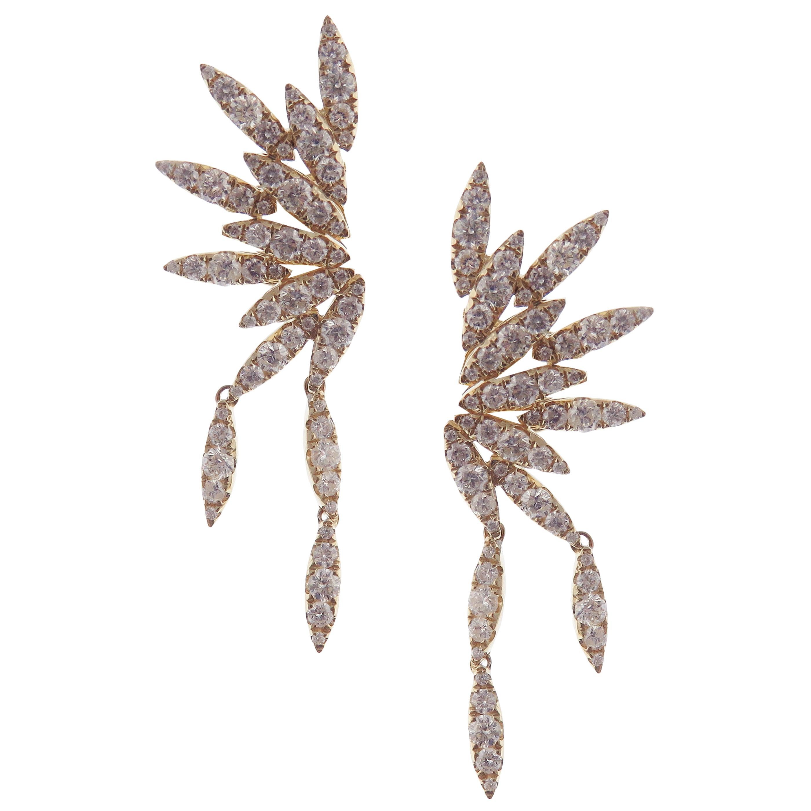 These trendy pave diamond wing crawler earrings with white diamonds are crafted in 18-karat yellow gold, featuring 130 round white diamonds totaling of 2.66 carats.
18-karat white gold are also available upon request.
Approximately 1.75''