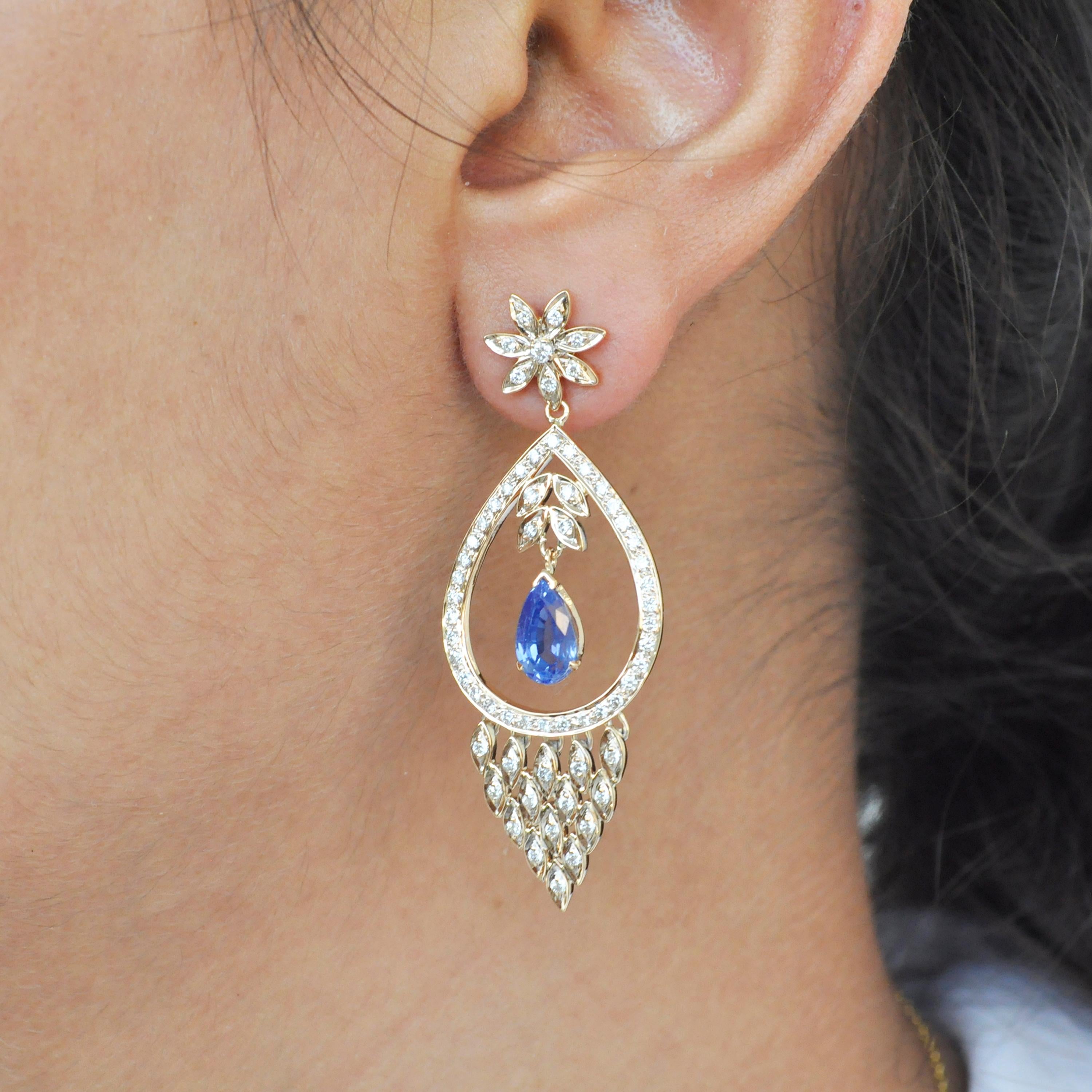These elegant dangler earrings with diamond and blue sapphire are sure to make a statement, when you wear them among your family and friends. A perfect combination of fashion and chic style, these earrings are beautifully crafted in 18K yellow gold