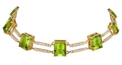 Girocollo ferroviario con peridoto e diamanti in oro giallo 18 carati