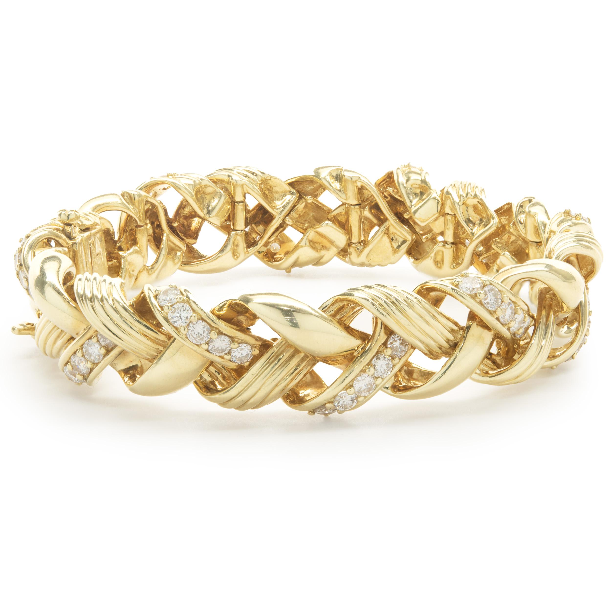 Designer: custom design
Material: 18K yellow gold
Diamonds: 60 round brilliant cut = 1.50cttw
Color: G
Clarity: SI1
Dimensions: bracelet will fit up to a 7-inch wrist
Weight: 82.91 grams