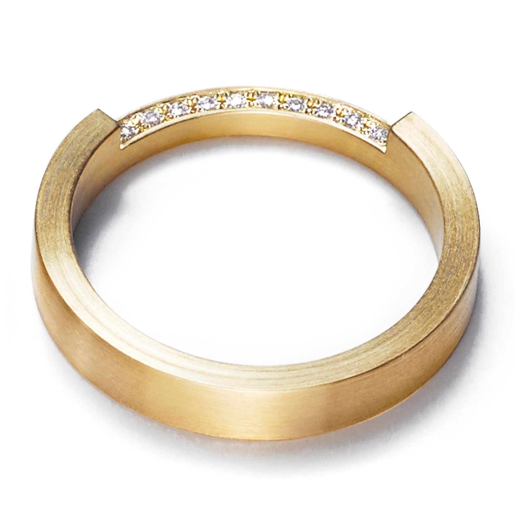The 'Assemble 01' ring has a square edge band with a quarter of the band narrowed in half and filled with diamonds. Ideal for stacking* with other rings from the 'Assemble' range.

Diamond: 1mm (amount varies depending on ring size)
Band width: