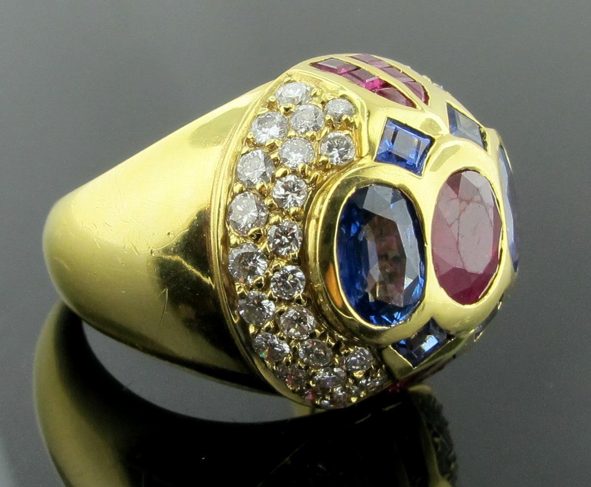 Oval Cut 18 Karat Yellow Gold Diamond, Ruby and Sapphire Dome Ring
