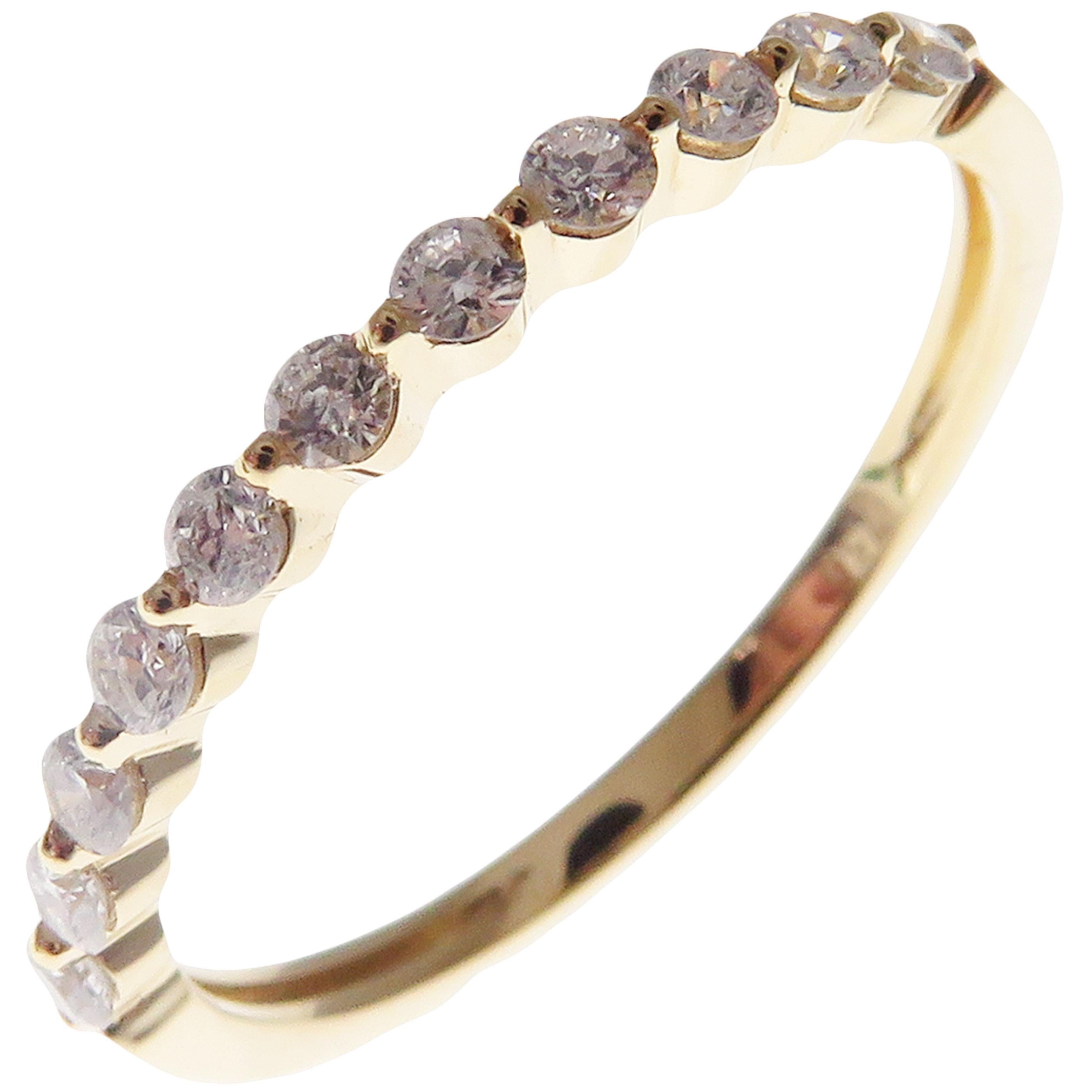 This simple stackable ring is crafted in 18-karat yellow gold, featuring 11 round white diamonds totaling of 0.31 carats.
Approximate total weight 2.25 grams.
Standard Ring size 7
SI-G Quality natural white diamonds.