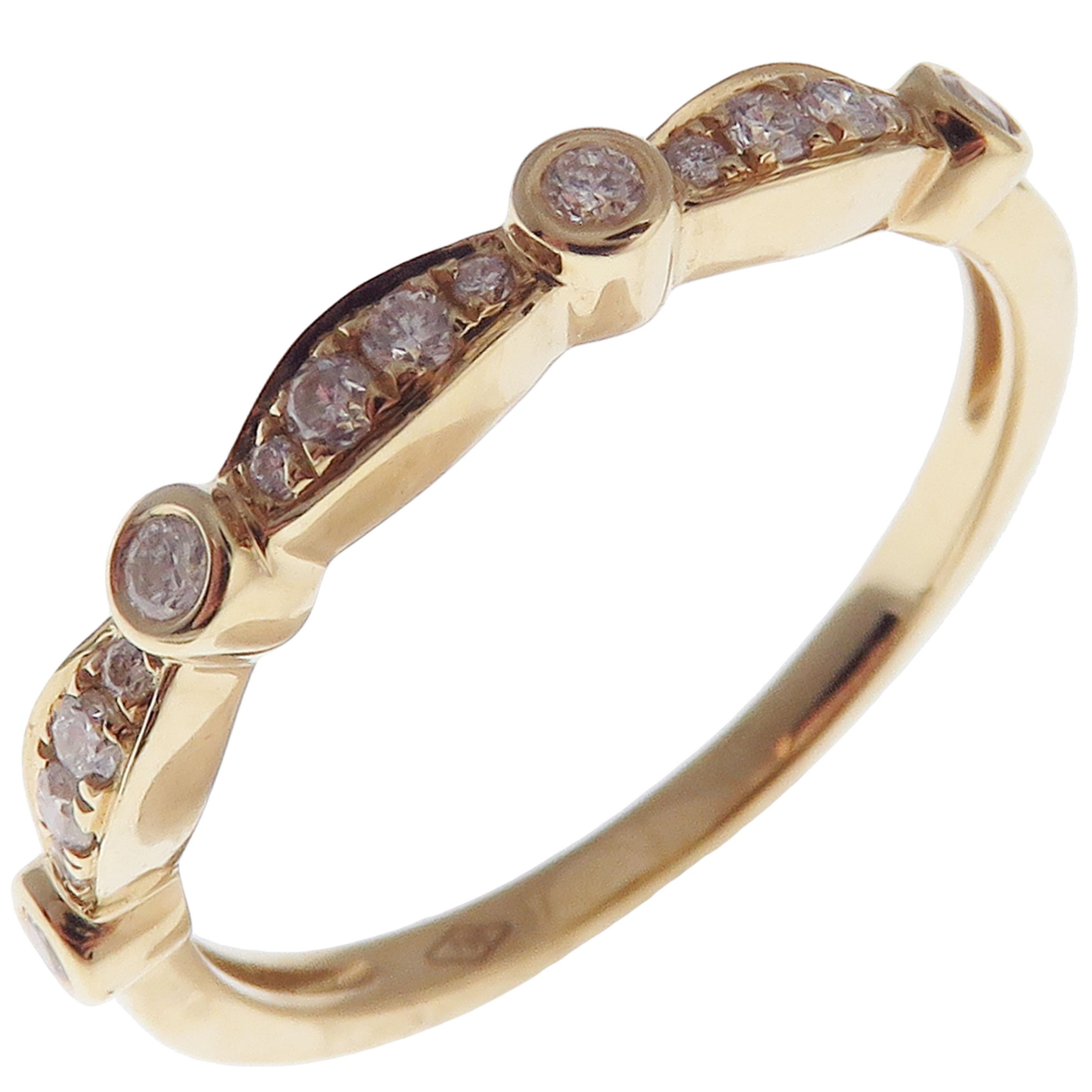 This simple stackable ring is crafted in 18-karat yellow gold, featuring 17 round white diamonds totaling of 0.19 carats.
Approximate total weight 2.10 grams.
Standard Ring size 7
SI-G Quality natural white diamonds.