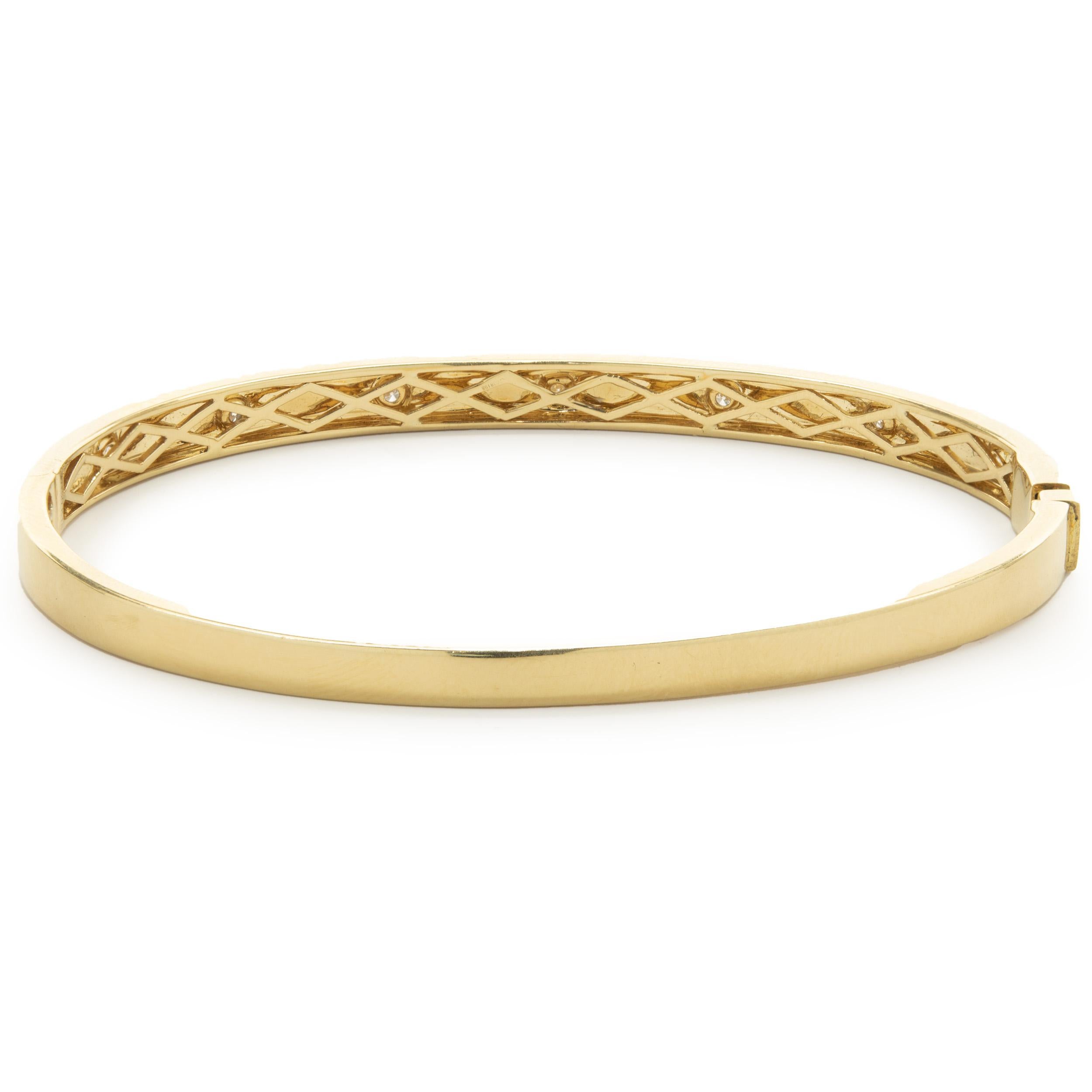 Designer: custom design
Material: 18K yellow gold
Diamonds: 7 round brilliant cut = .15cttw
Color: G
Clarity: VS2
Dimensions: bracelet will fit up to a 7.5-inch wrist
Weight: 14.06 grams