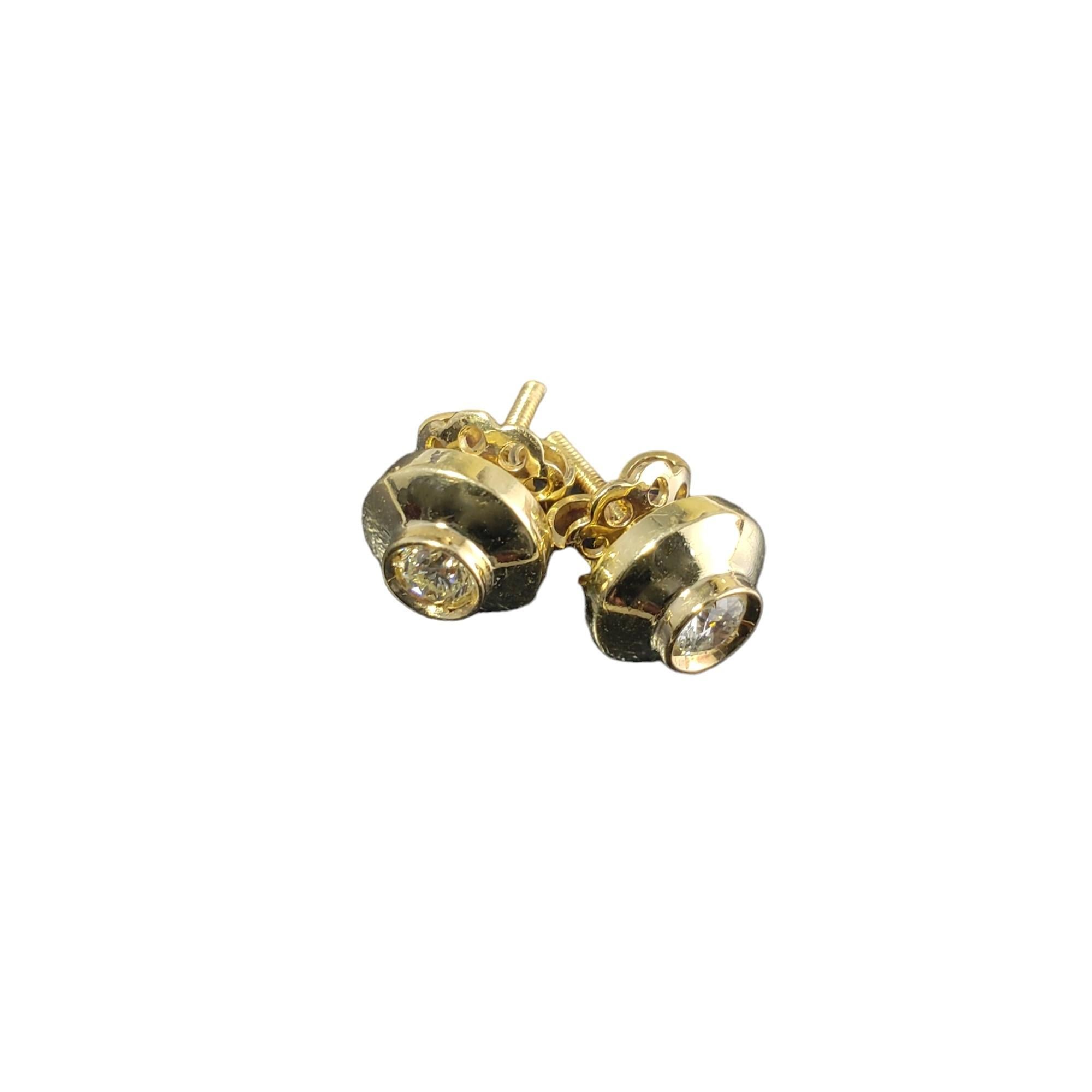 Vintage 18K Yellow Gold Diamond Stud Earrings-

These sparkling earrings each feature one round brilliant cut diamond set in classic 18K yellow gold.  Screw back closures.

Approximate total diamond weight: .30 ct.

Diamond color: G

Diamond