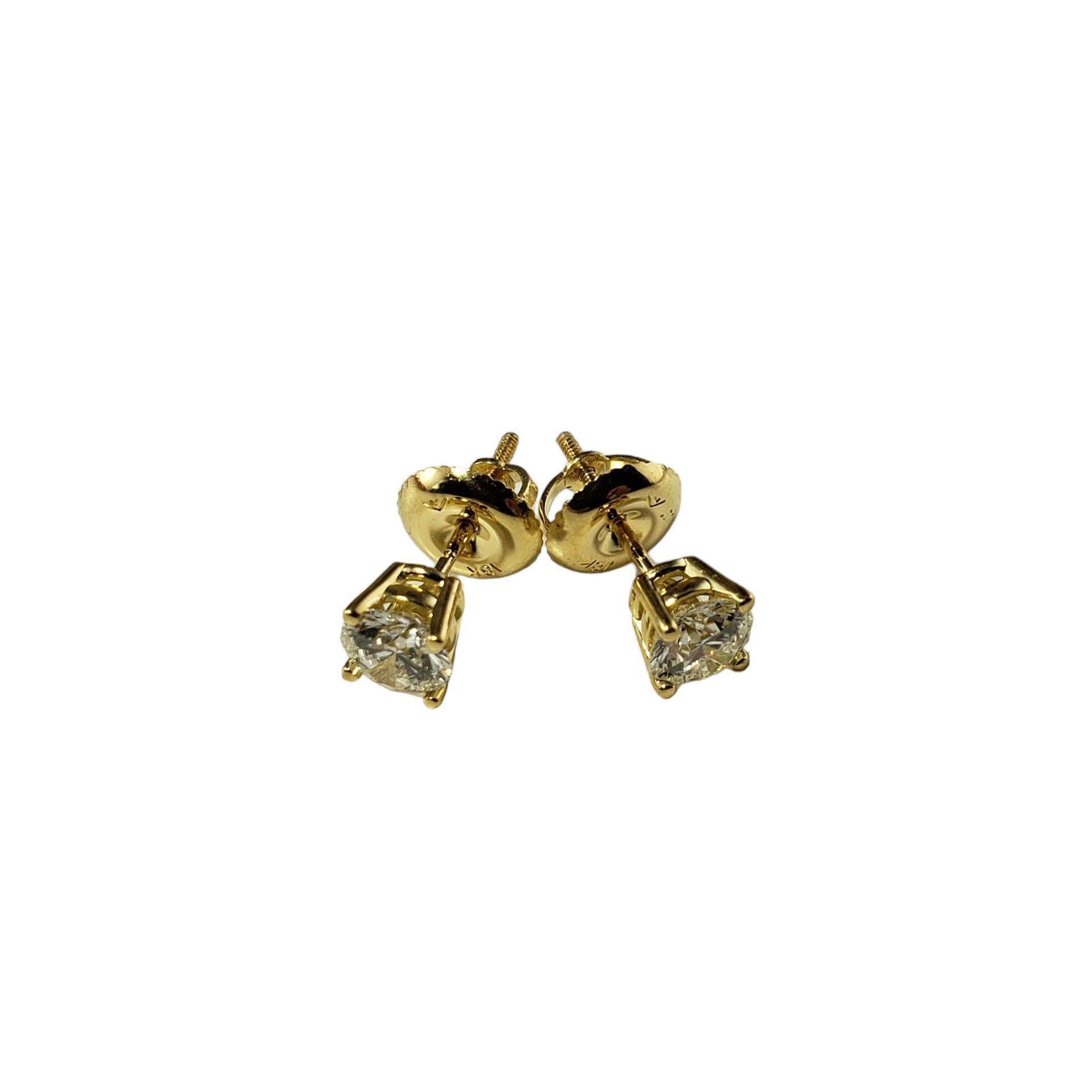 Vintage 18 Karat Yellow Gold Diamond Stud Earrings-

These sparkling stud earrings each feature one round brilliant cut diamond set in classic 18K yellow gold. Screw back closures.

Approximate total diamond weight: .70 ct.

Diamond color: