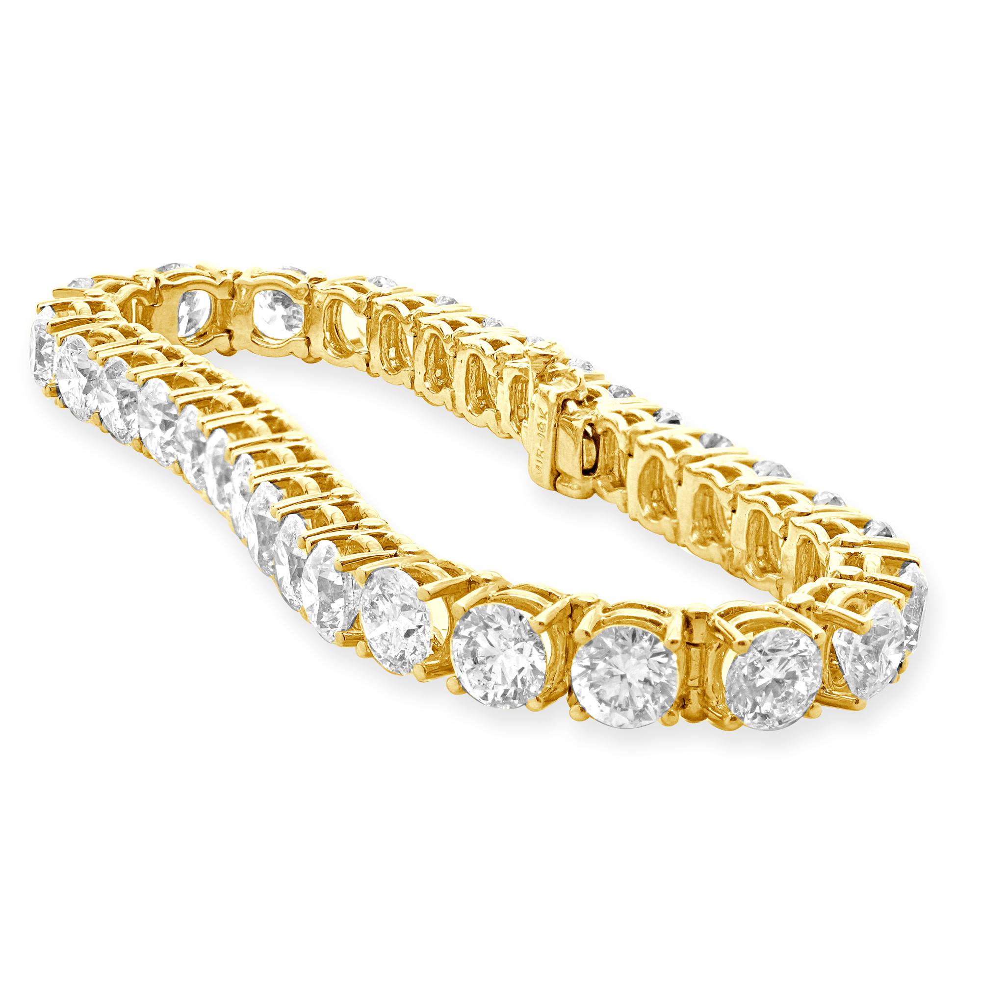 Material: 18K yellow gold
Diamonds: round brilliant cut = 21.35cttw
Color: G / H
Clarity: SI1-2
Dimensions: bracelet will fit up to a 7-inch wrist 
Weight: 25.18 grams