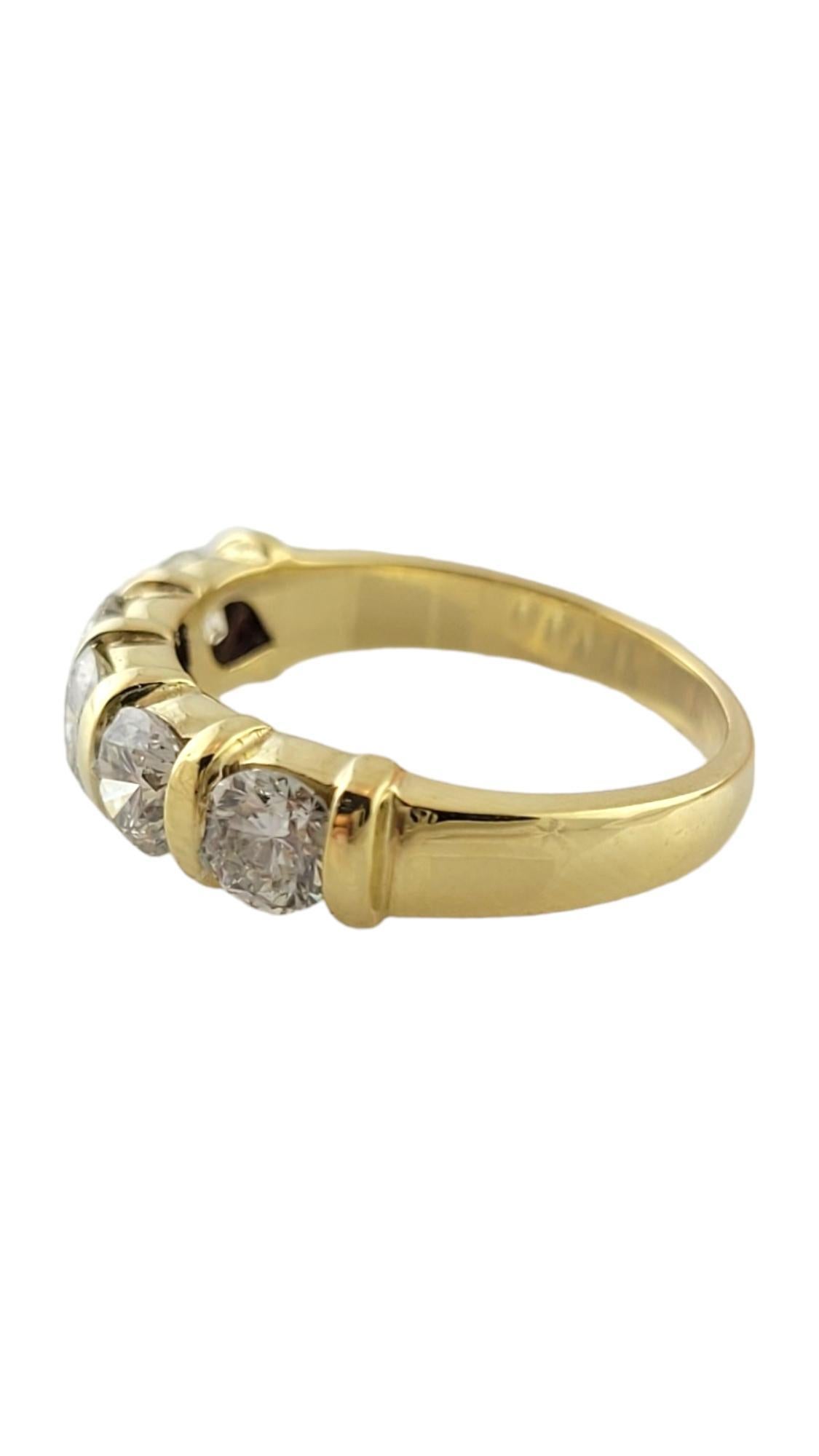 Vintage 18 Karat Yellow Gold and Diamond Wedding Band Ring Size 7.25

This sparkling band features five round brilliant cut diamonds set in classic 18K yellow gold. 

 Width:  5 mm.  Shank:  2.5 mm.

Approximate total diamond weight:  1.50