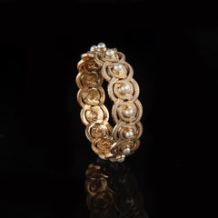 18 Karat Yellow Gold Bow Bridge Bangle with Diamonds and Pearls