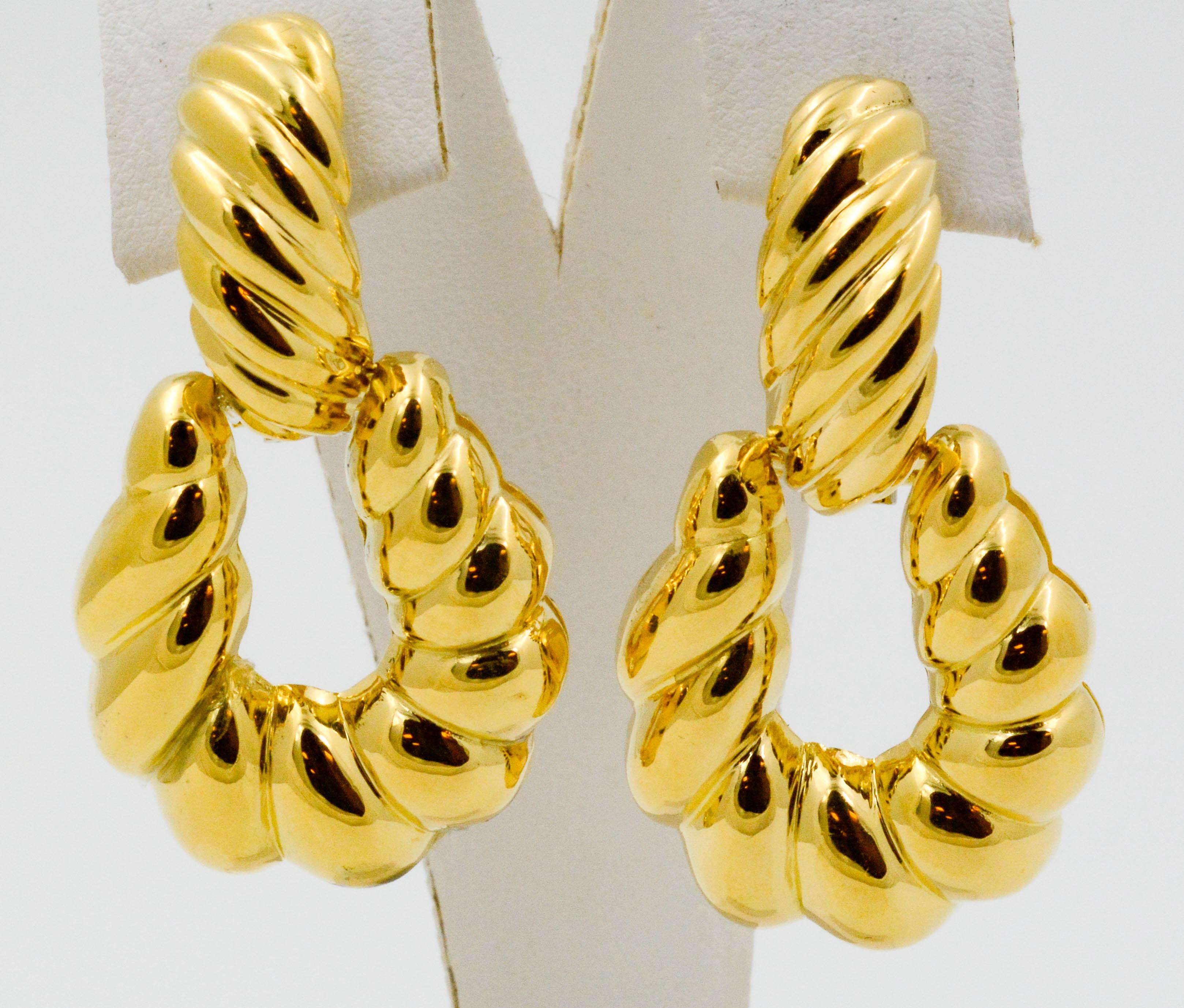Circa 1980's 18 karat Italian yellow gold ridged door knocker clip-on earrings with clip back. Delightfully light and comfortable to wear.