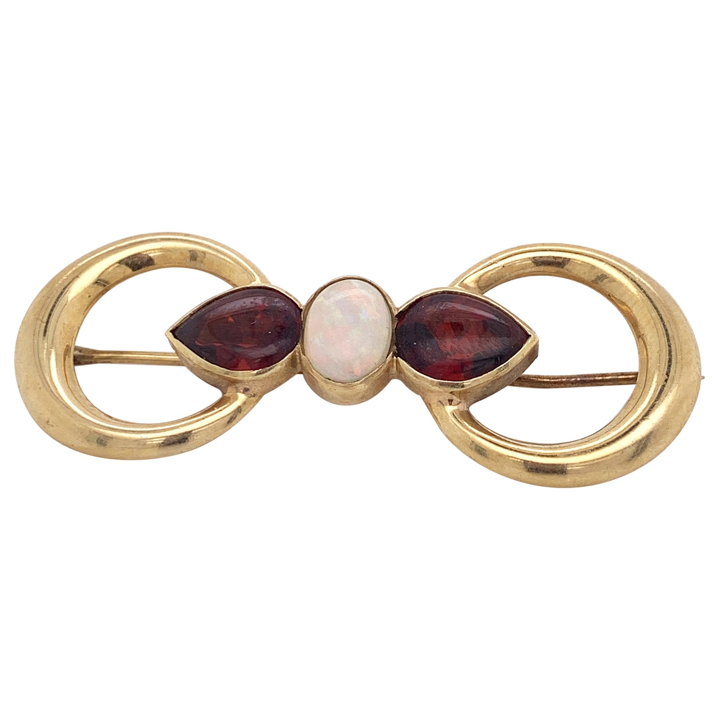 18 Karat Yellow Gold Double Ring Brooch with Opal and Garnet Stones