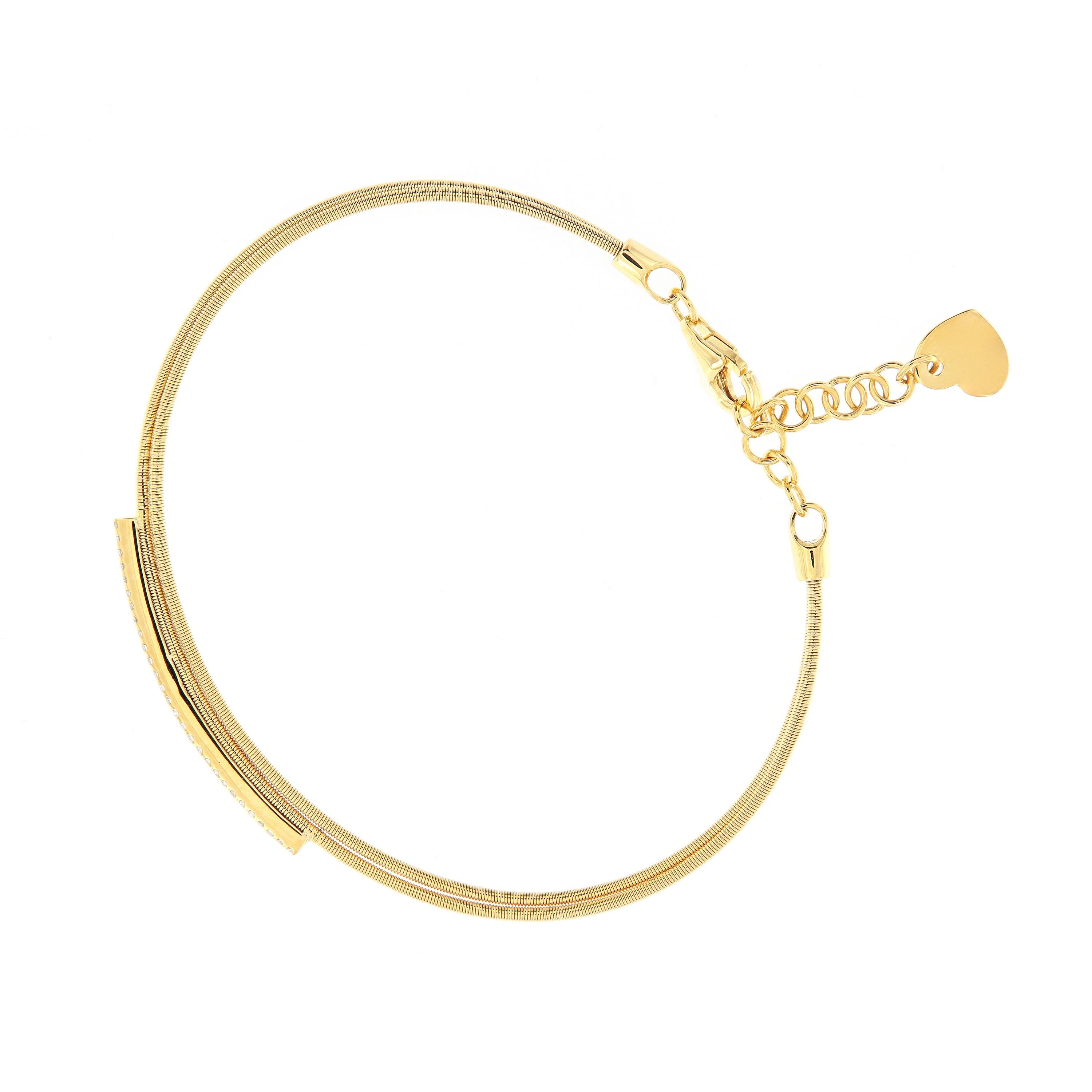 Wrap her wrist in the sparkle and comfort. This double wire bracelet is crafted in 18k yellow gold accented with a 18k yellow bar of diamonds. Bracelet secures with a safety chain clasp detailed with a heart dangle. Weighs 5.5 grams. Measures 2.25