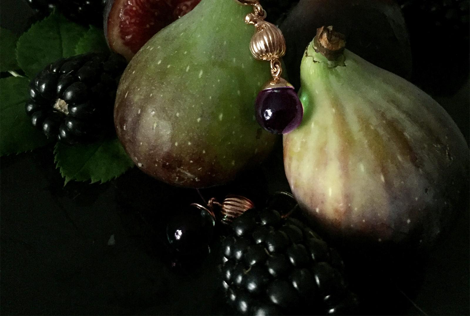 This 18 karat yellow gold Fig drop pendant necklace features a cabochon natural amethyst gem that is open to light. The collection was previously featured in Vogue UA.

The artist, Polya Medvedeva, was inspired to create a jewelry collection