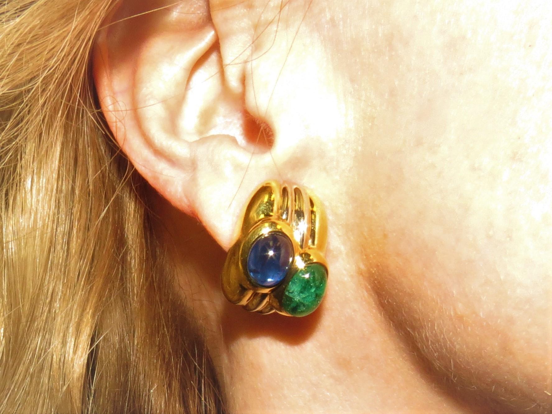 18K yellow gold earclips, by Giovanne, set with 2 oval cabochon blue sapphires and two oval emeralds weighing 14.89cts total.
Retail 11,500