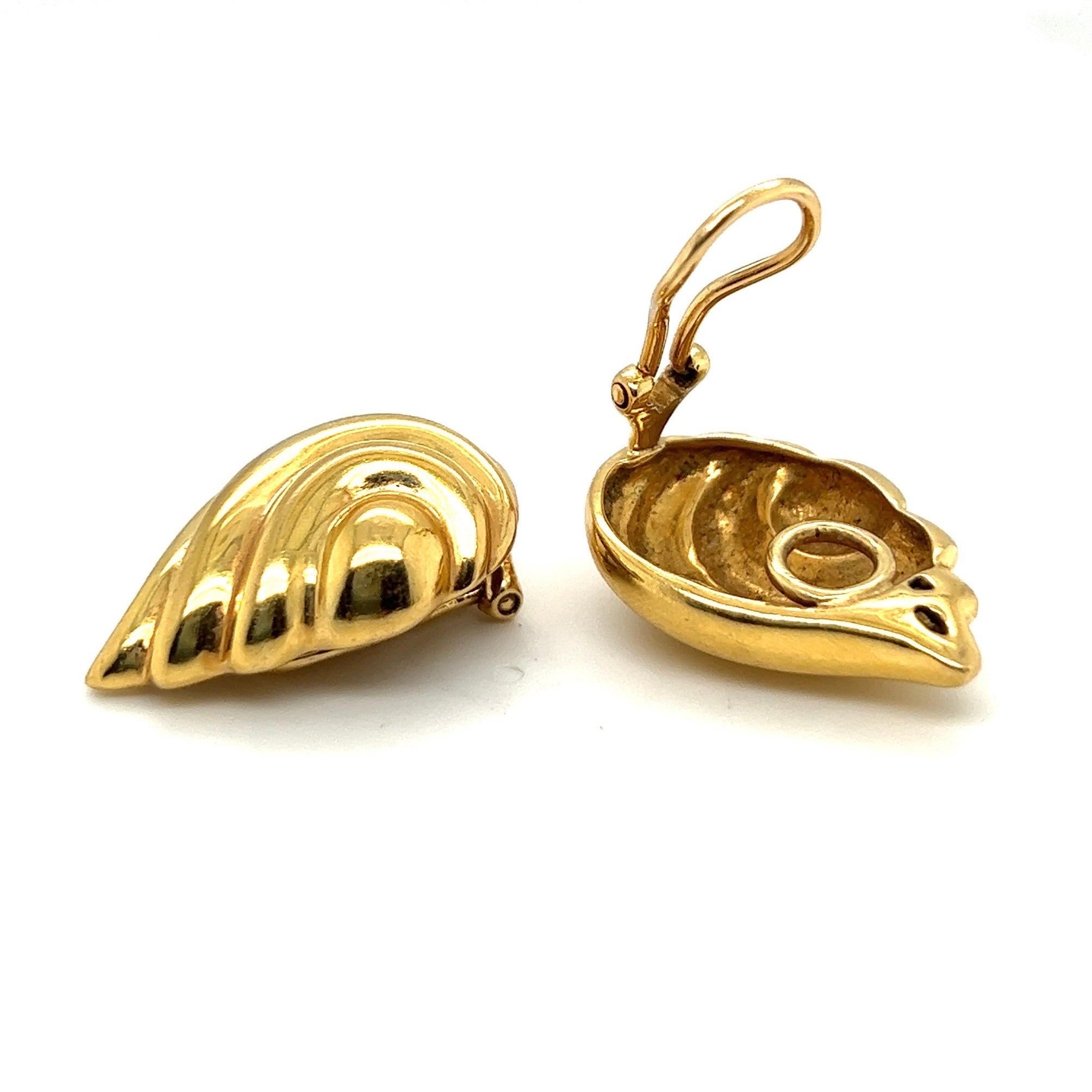 Stylish pair of 18 Karat Yellow Gold Earrings by Verdura.
Crafted in 18 karat ribbed yellow gold and designed as sculpted leaves, these beautiful earrings are meant to be worn up the lobe. 
They are completed by comfortable hinged omega backs.
The