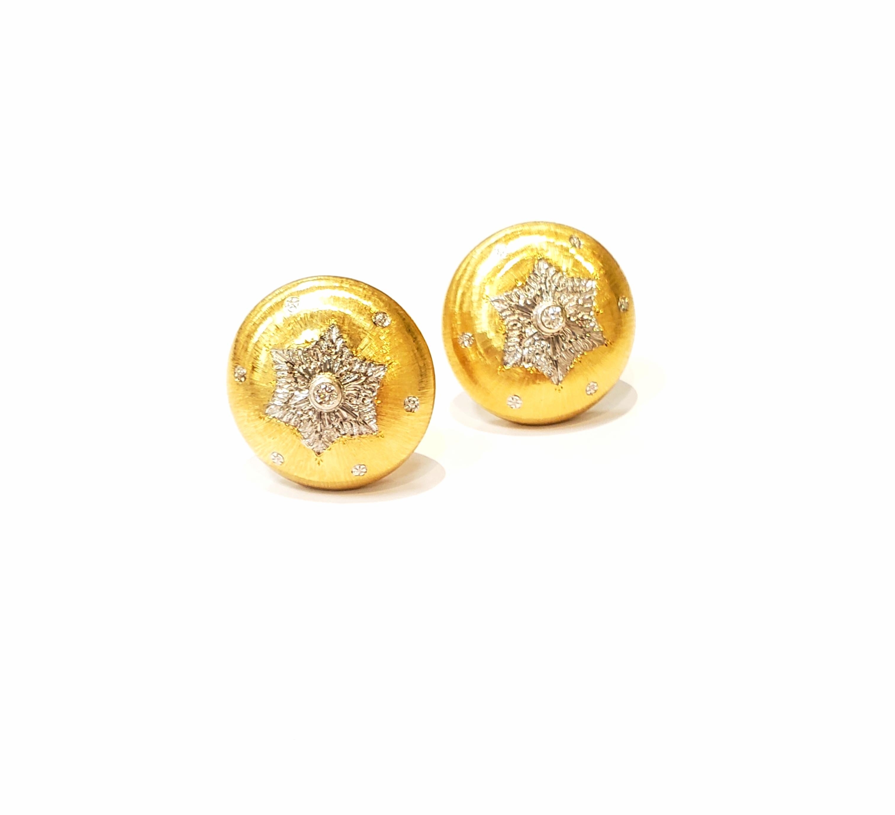 18 karat yellow gold button clip on earrings, with engraved white gold snowflake design. There is a bezel set diamond in the center of snowflake.  Earrings have a brushed satin finished.  A post can be added. Diamonds are approximately 0.06ct.