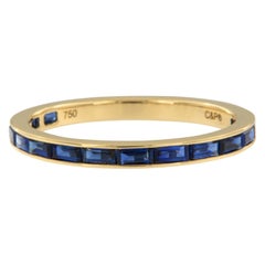 18 Karat Yellow Gold East-West Style Baguette Blue Sapphire Eternity Band Ring