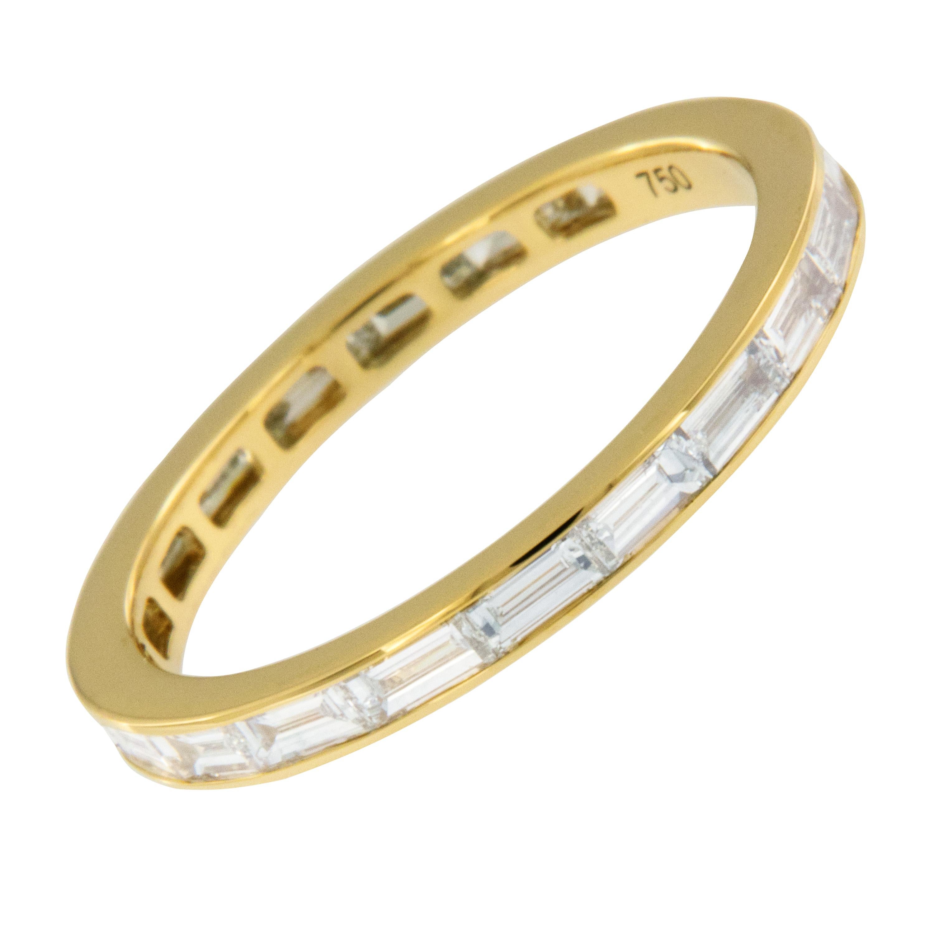 Expertly crafted in royal 18 karat yellow gold this timeless baguette cut diamond eternity band is a perfect addition to an existing engagement ring, for wearing alone and also looks fantastic stacked! 20 baguette cut fine quality diamonds (VS, F-G)