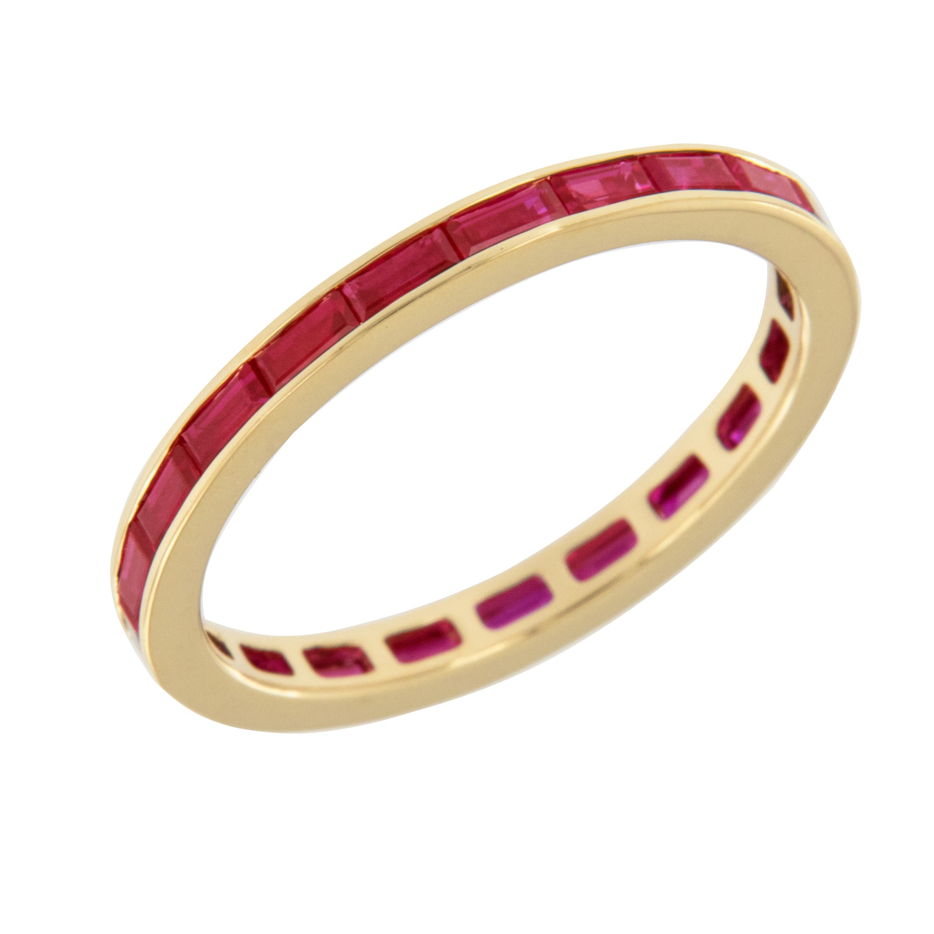 Expertly crafted in royal 18 karat yellow gold this timeless baguette cut ruby eternity band is a perfect addition to an existing engagement ring, for wearing alone and also looks fantastic stacked! 21 baguette cut fine quality rubies = 1.14 Cttw