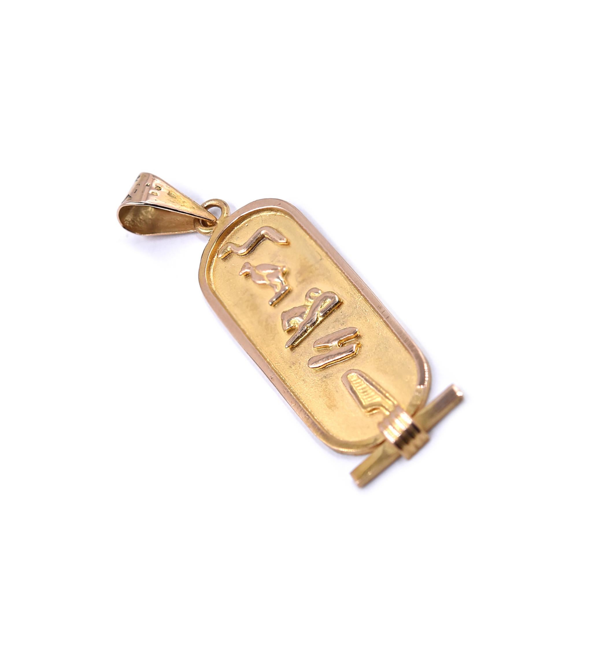 Designer: custom
Material: 18K yellow gold 
Dimensions: pendant measures 44 X 11.5mm
Weight: 2.51 grams
