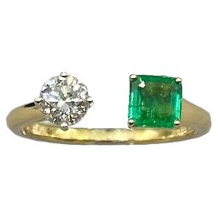 18 Karat Yellow Gold Emerald and Diamond Bypass Ring For Sale