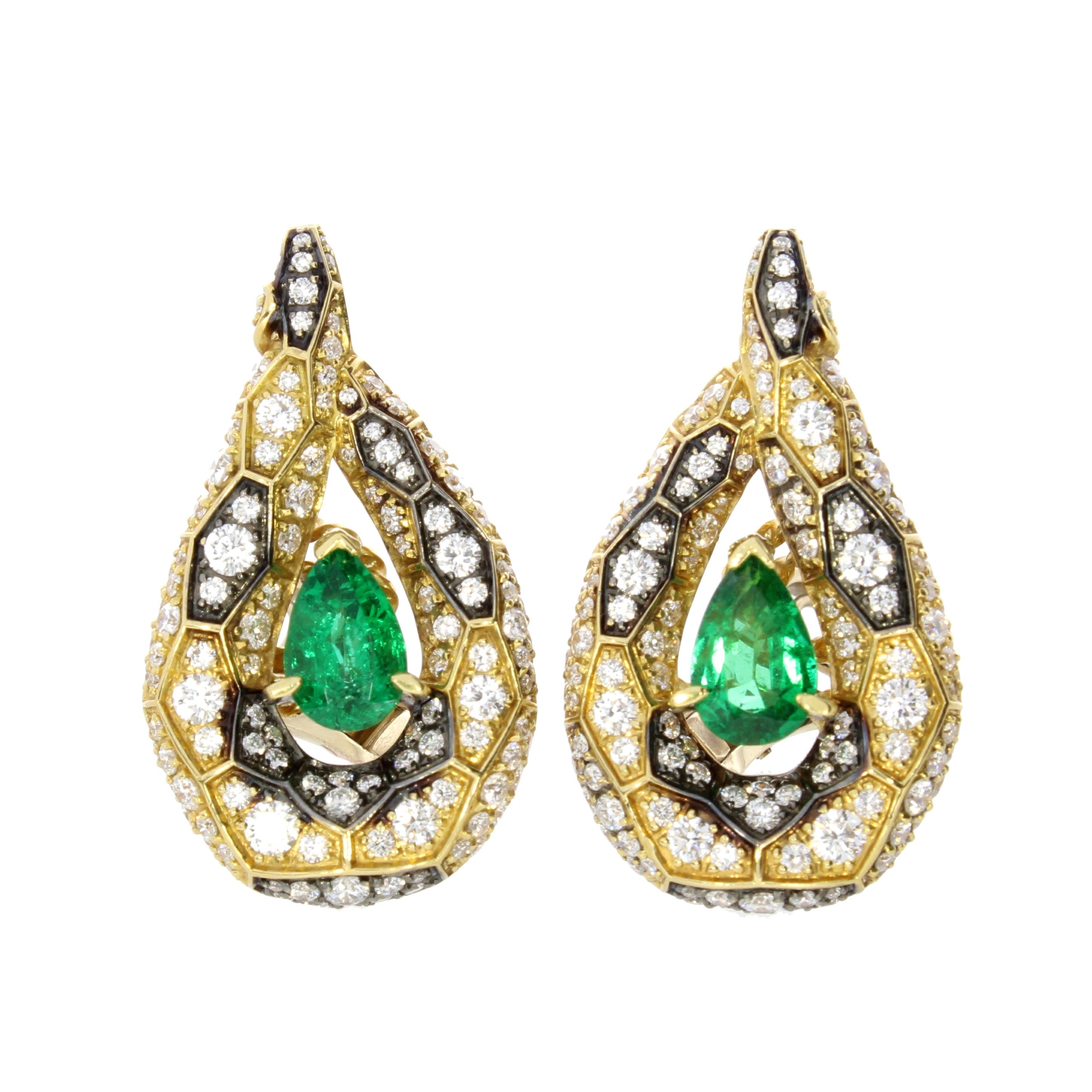 A pair of elegant tear drops depict the enchanting serpent with a vibrant emerald suspended in between scintillating scales of brilliant cut diamonds.

Niquesa Ophidian Ear Climbers
18 karat Yellow Gold
2.16 carat Pear Shaped Emerald
2.82 carat