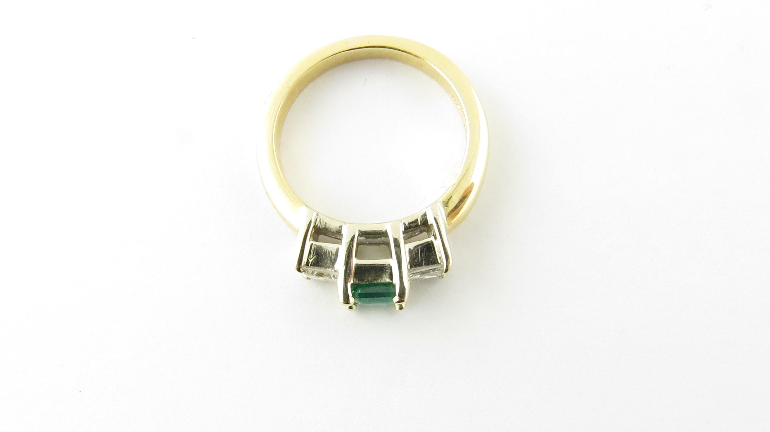 Vintage 18 Karat Yellow Gold Natural Emerald and Diamond Ring Size 5.5-

This lovely ring features one genuine emerald (approx. 5 mm x 4 mm) and two princess cut diamonds set in classic 18K yellow gold.  

Shank measures 2.5 mm.

Approximate total