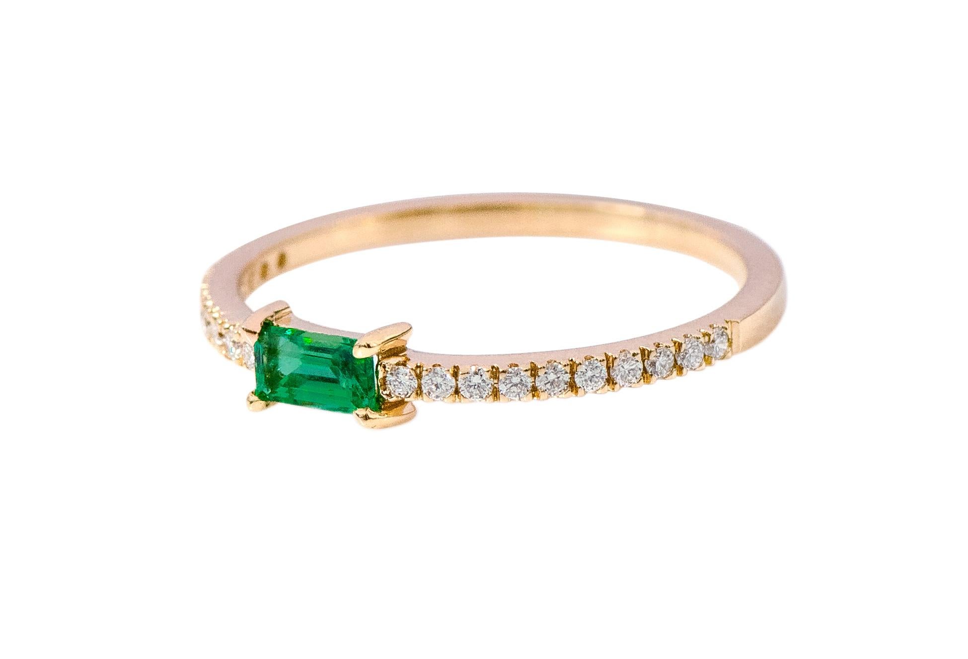 18 Karat Yellow Gold Emerald and Diamond Solitaire Eternity Band Ring

This exquisite vivid green emerald and diamond ring is scintillating. The solitaire baguette cut emerald in eagle prong box setting in rose gold is perfect. The thin band of half