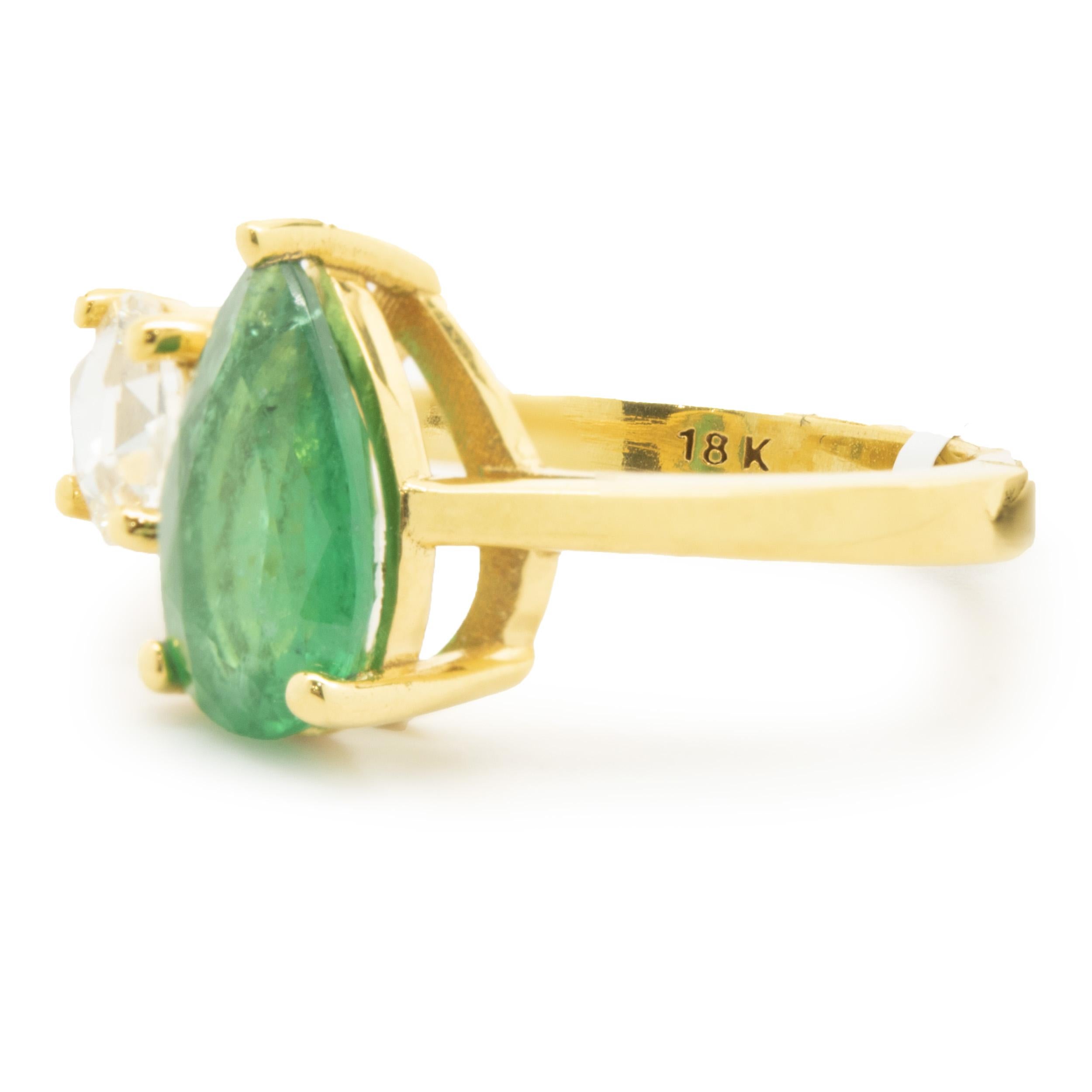 Designer: custom design
Material: 18K yellow gold
Diamond: 1 rose cut = 0.56cttw
Color: G
Clarity: SI1
Emerald: 1 pear cut = 1.93ct
Dimensions: ring top measures 11.76mm wide
Ring Size: 6 (please allow two extra shipping days for sizing requests)