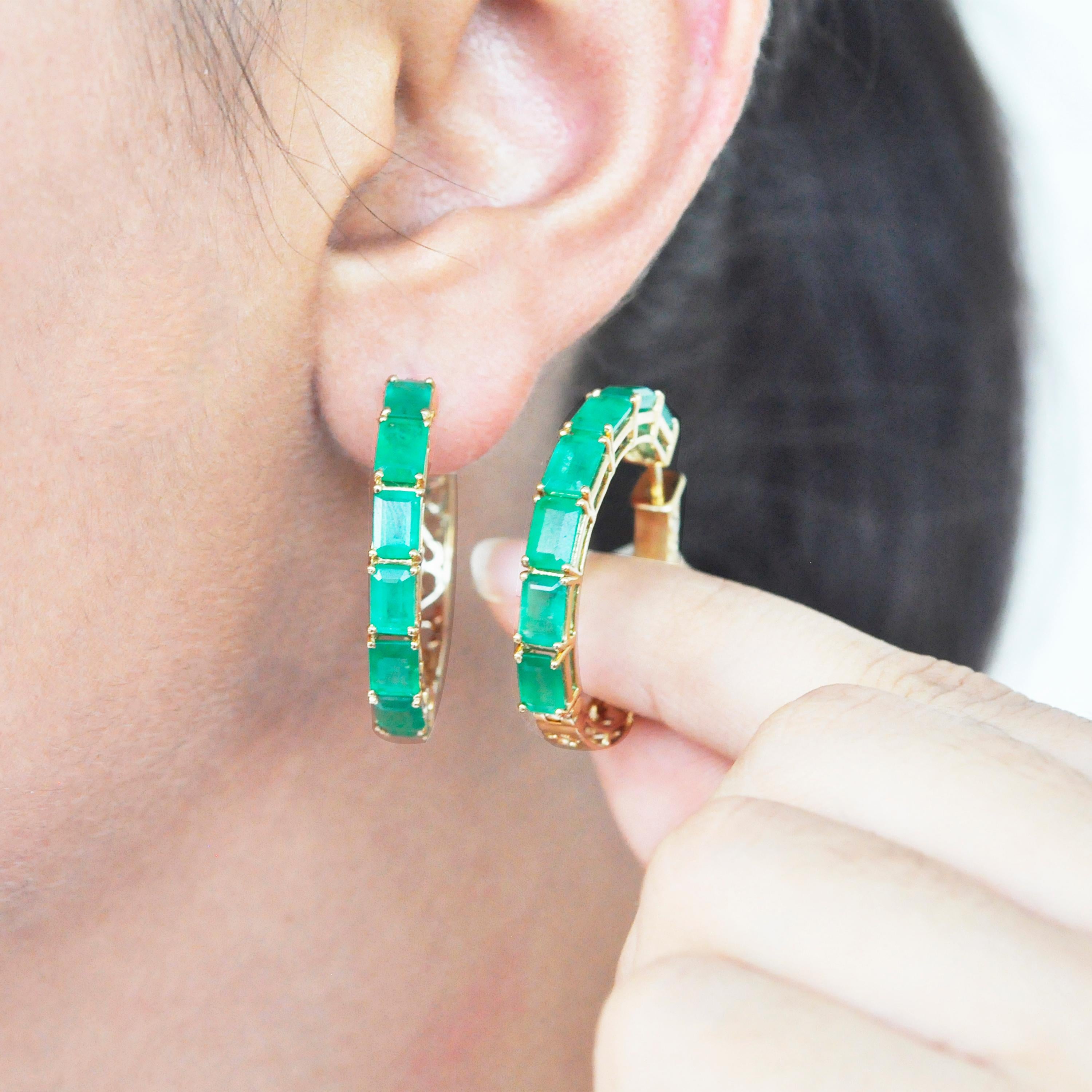 18 karat yellow gold emerald cut octagon brazilian emerald hoop earrings. 

This enchanting lush green brazilian emeralds hoop earring is impressive. The hoop is created with 12 perfect matching emerald cut emeralds of size 6x4 mm each. The prong