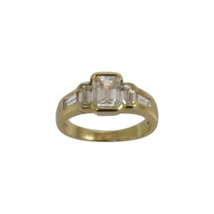 18 Karat Gelbgold Diamantring mit Smaragdschliff